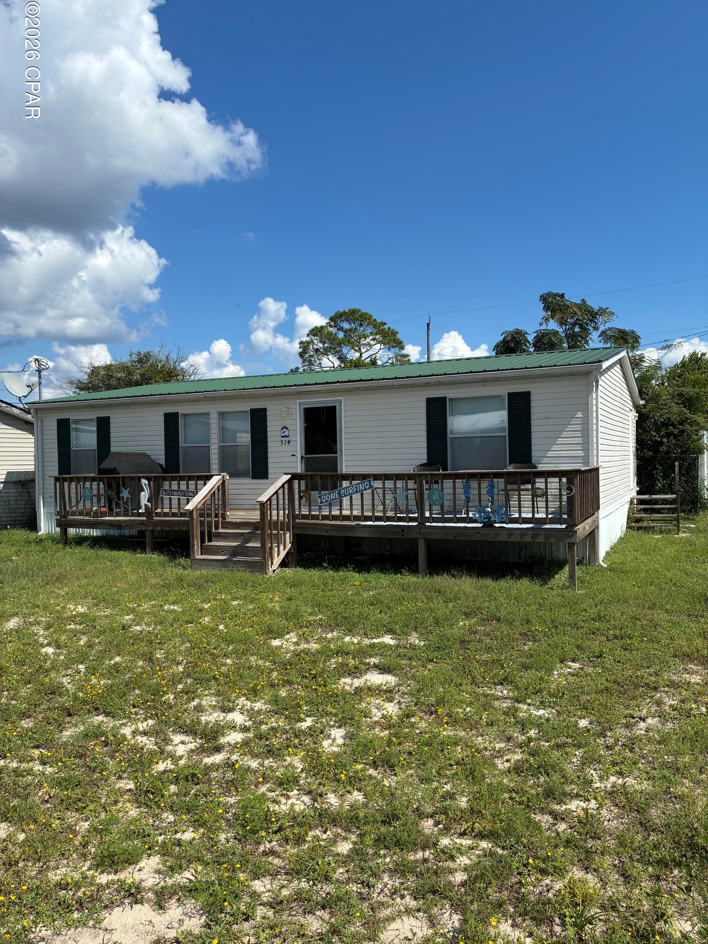 GULF VIEWS, COASTAL LIVING & INVESTMENT POTENTIAL! Just THREE BLOCKS from the stunning Gulf waters of Laguna Beach, 314 El Reposo Place puts you right in the heart of the Panama City Beach lifestyle! Better yet, you can see the beautiful Gulf waters as you pull into the driveway. This meticulously maintained, fully furnished 3-bedroom, 2-bath home offers incredible potential as a primary residence, vacation getaway, or short-term rental investment.

Inside, you'll find 1,080 square feet of comfortable coastal living with two large bathrooms, including a spacious primary bath with a built-in makeup vanity. The home is being sold fully furnished and is thoughtfully equipped for guests, featuring a sleeper sofa in the living room and an additional rollaway bed beyond the three bedrooms.

Major updates mean you can enjoy the beach lifestyle with added peace of mind, including a new HVAC system, new hot water heater, and a roof installed in 2024. The home has been immaculately cared for and is truly ready for its next owners.

The location is the star of the show! Just three blocks to the Gulf and Laguna Beach, with Panama City Beach's beautiful beaches, restaurants, shopping, entertainment, and attractions all nearby. With short-term rentals permitted, this property presents an exciting opportunity in one of the area's most desirable coastal destinations.

Whether you're looking for your own slice of paradise, a vacation home, or a property with rental potential, this one checks the boxes. Coastal properties this close to the Gulf don't come along every day--schedule your private showing today and make 314 El Reposo Place your next piece of paradise! Sellers open to 1,000 towards concessions for new flooring. New photos coming soon