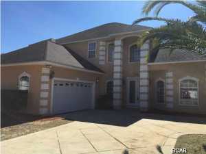 This home is among the largest in the desirable Palm Bay neighborhood. This beautiful home has 20 ft ceilings, large neutral tile in the main areas and multiple French doors leading out to the screened in pool and patio. With a Mediterranian design floor plan and dramatic curved staircase, this stunning home has the wow factor when you step into the front door! The home has been freshly painted inside AND out. There is a large fireplace surrounded by custom cabinetry, all accenting the grandeur of the large open space. There is a formal dining room next to the eat in kitchen and an additional room or flex space. The master suite is large with direct access to the pool area. The luxurious master bath has travertine floors and a large walk in closet. There is a jetted tub and separate