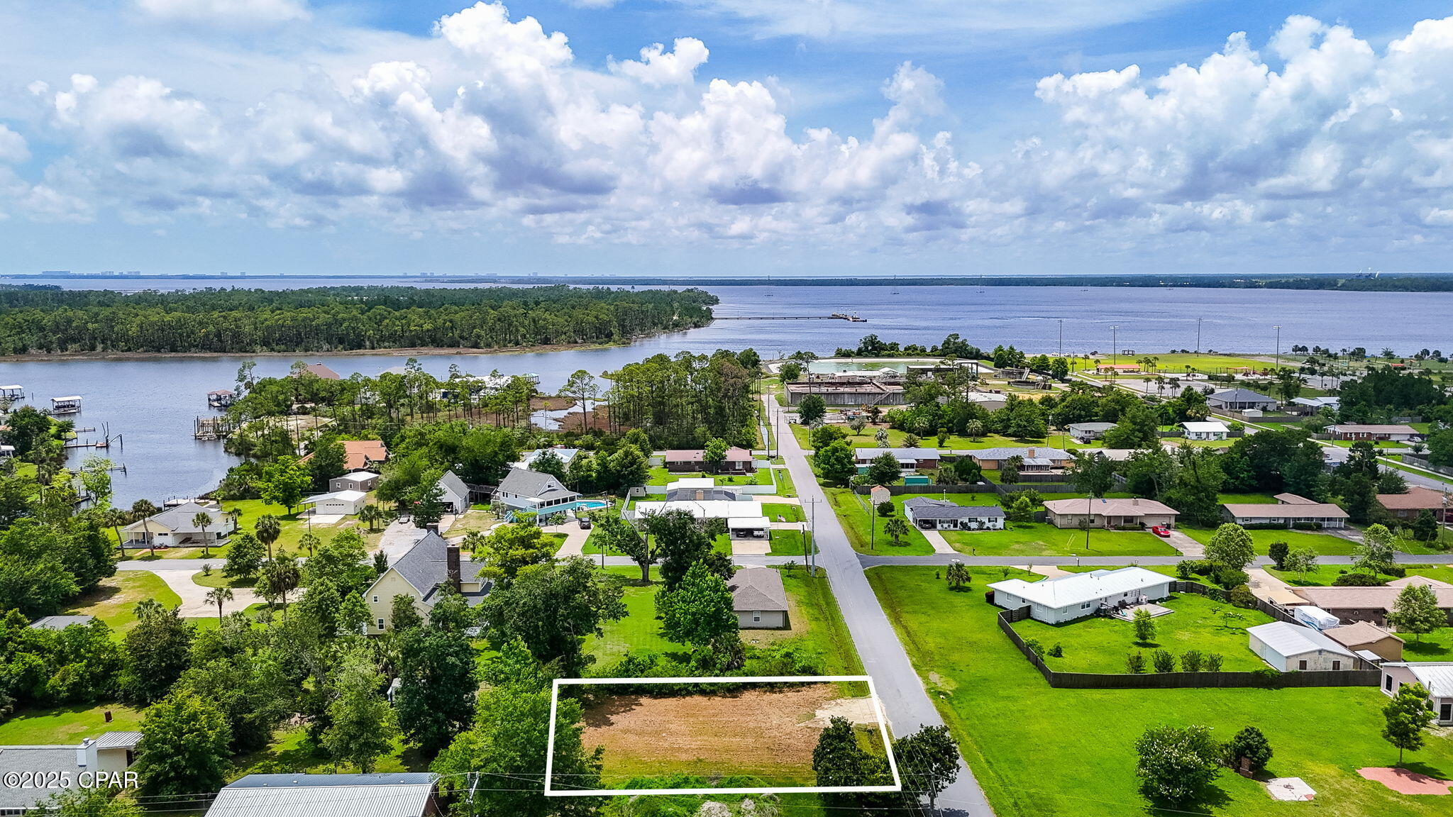 Get ready to build your home in the fast-growing, highly desirable Lynn Haven, Florida community...where you'll be steps away from the beautiful Bay waters. This is a .172 acre homesite where the Seller offers a completed survey and elevation certificate as well as the culvert being complete.

This 75' x 100' homesite has been cleared and is ready for your home. This homesite is in a USDA eligible area allowing for 100% financing for qualified Buyers to build their own home. This homesite is also qualified for FHA, VA and conventional loans, as well, to qualified Buyers.

The Lynn Haven community sits on North Bay and is close to St. Andrews Bay, making boating, fishing, and kayaking popular activities. With no HOA, you'll enjoy parking your boat at your home and being just a few minutes to the public boat ramp at Leslie Porter Wayside Park.

There's a reason people LOVE Lynn Haven and it's the community! A.L. Kinsaul Park is just down from this homesite offer 7 acres of fun with the best sunsets, concerts year-round, playground with splash pad, dog park and so much more. Sharron Sheffield Park is known as the heart of the community and offers farmers markets, holiday events, playground, ponds and activities year-round.

This community provides a unique blend of coastal charm, small-town atmosphere, and growing suburban convenience. Community events like parades, farmer's markets, and seasonal festivals create a welcoming, hometown feel and you will love calling Lynn Haven, Florida home. Lynn Haven was recognized in 2024 as a top place to live in Florida, particularly for raising families! 

If you are ready to build your home in one of the best kept secrets in Florida, don't miss out on this opportunity!