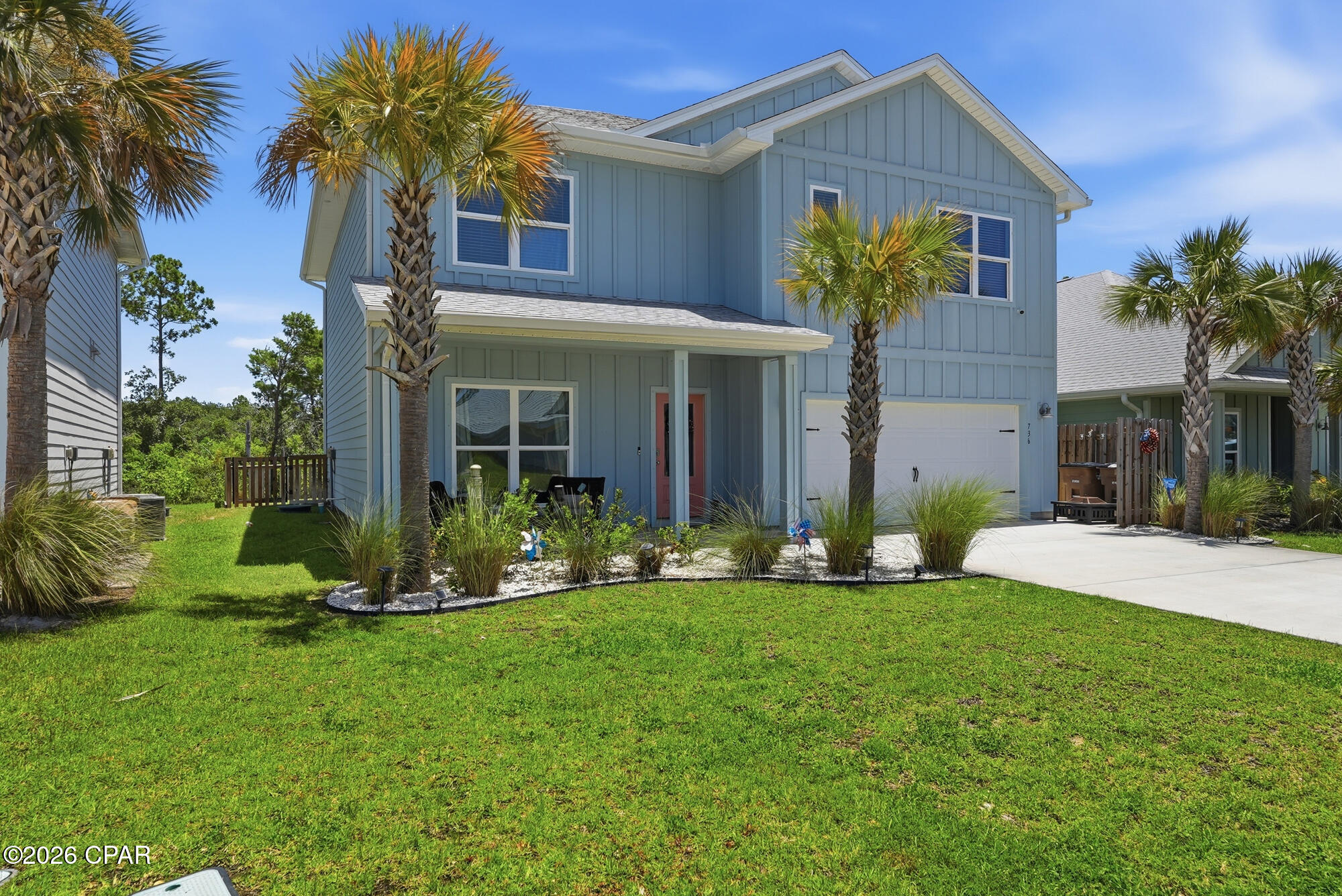 Welcome to 736 Backwater Road, where modern coastal living meets the laid-back lifestyle of WindMark Beach. This beautifully designed 5-bedroom, 3-bath home offers more than 2,500 square feet of thoughtfully planned living space, making it an exceptional choice for a primary residence, vacation retreat, or investment property along Florida's Forgotten Coast. Don't worry about a golf cart, because one is included in the sale! Inside discover an open-concept floor plan filled with natural light, where the spacious living, dining, and kitchen areas blend seamlessly to create the perfect setting for everyday living and entertaining. The well-appointed kitchen features generous workspace, abundant cabinetry, and an oversized island ideal for gathering with family and friends. The thoughtfully designed layout provides comfortable accommodations for family and guests alike, with spacious bedrooms and flexible living areas that easily adapt to your lifestyle. Outside, unwind on the covered patio while enjoying the peaceful coastal atmosphere, or take advantage of the attached garage with ample room for vehicles, golf carts, bicycles, paddleboards, and all your beach essentials. Every detail has been designed to complement the relaxed coastal lifestyle that makes WindMark Beach so desirable. Great location and only 1200 ft from Good Morning St. which is the heartbeat of Windmark, where residents can enjoy outstanding community amenities including resort-style pools, scenic walking and biking trails, boardwalks, fitness facilities, playgrounds, and convenient beach access. The vibrant WindMark Beach Town Center offers dining, shopping, and community events just moments from your doorstep, while historic downtown Port St. Joe, St. Joseph Bay, world-class fishing, boating, kayaking, and the sugar-white beaches of the Gulf of Mexico are only minutes away. Great investment opportunity to enjoy the unmatched charm of Gulf County's coastal lifestyle.