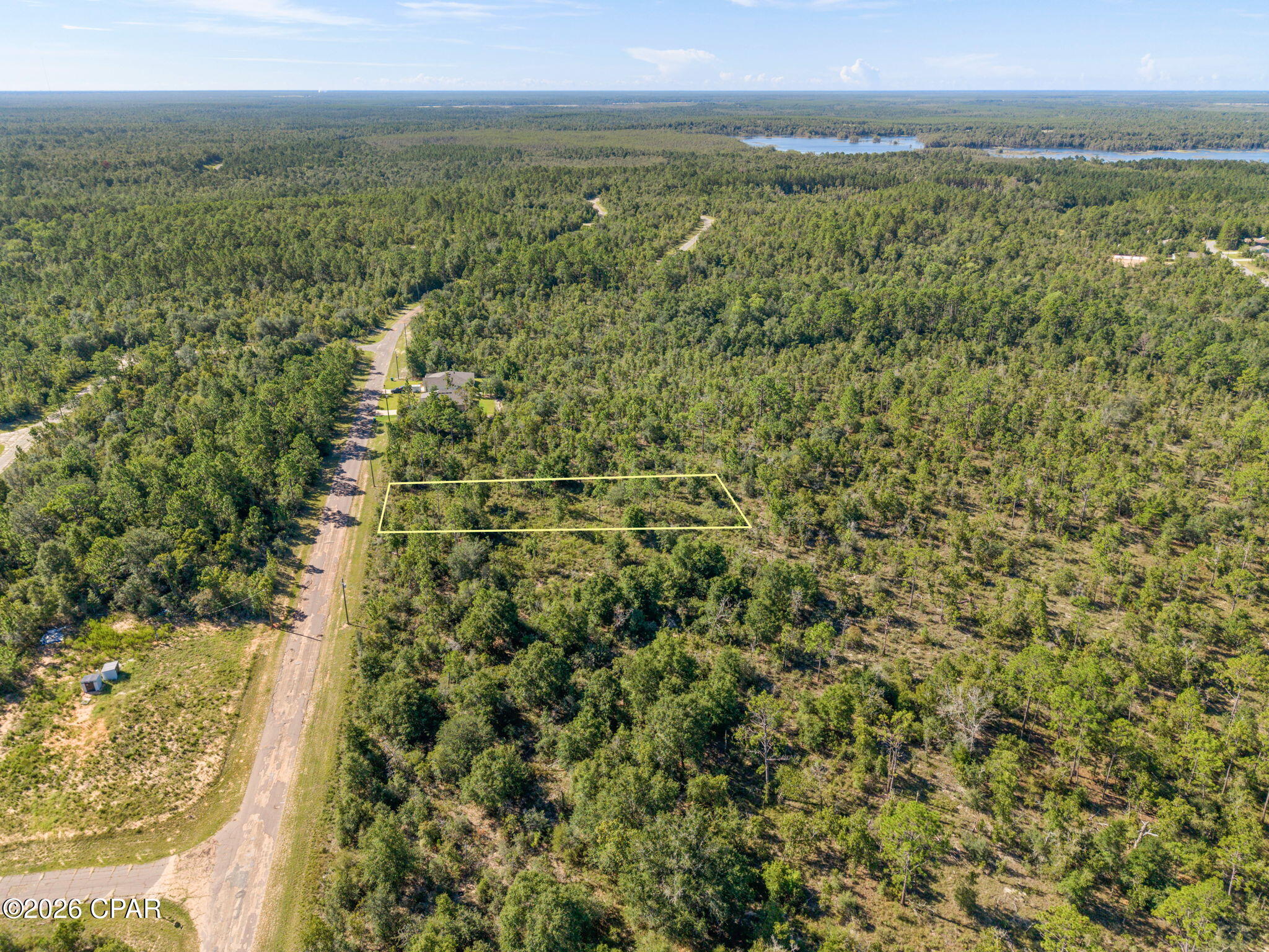 Build your future in the growing Sunny Hills community with this 0.58+/- acre vacant parcel. This wooded lot is located directly next to another available parcel, creating an excellent opportunity to purchase both for additional space, privacy, or a larger homesite. Sunny Hills offers a peaceful Northwest Florida setting while remaining conveniently located between Chipley and the Panama City area. The community continues to see growth and features an affordable 18-hole public golf course, Boat Lake with a swimming beach, and numerous outdoor recreational opportunities. Whether you're searching for a future homesite, looking to purchase adjoining lots, or investing in land for future growth, this property offers an affordable opportunity to own a piece of the expanding Sunny Hills community.