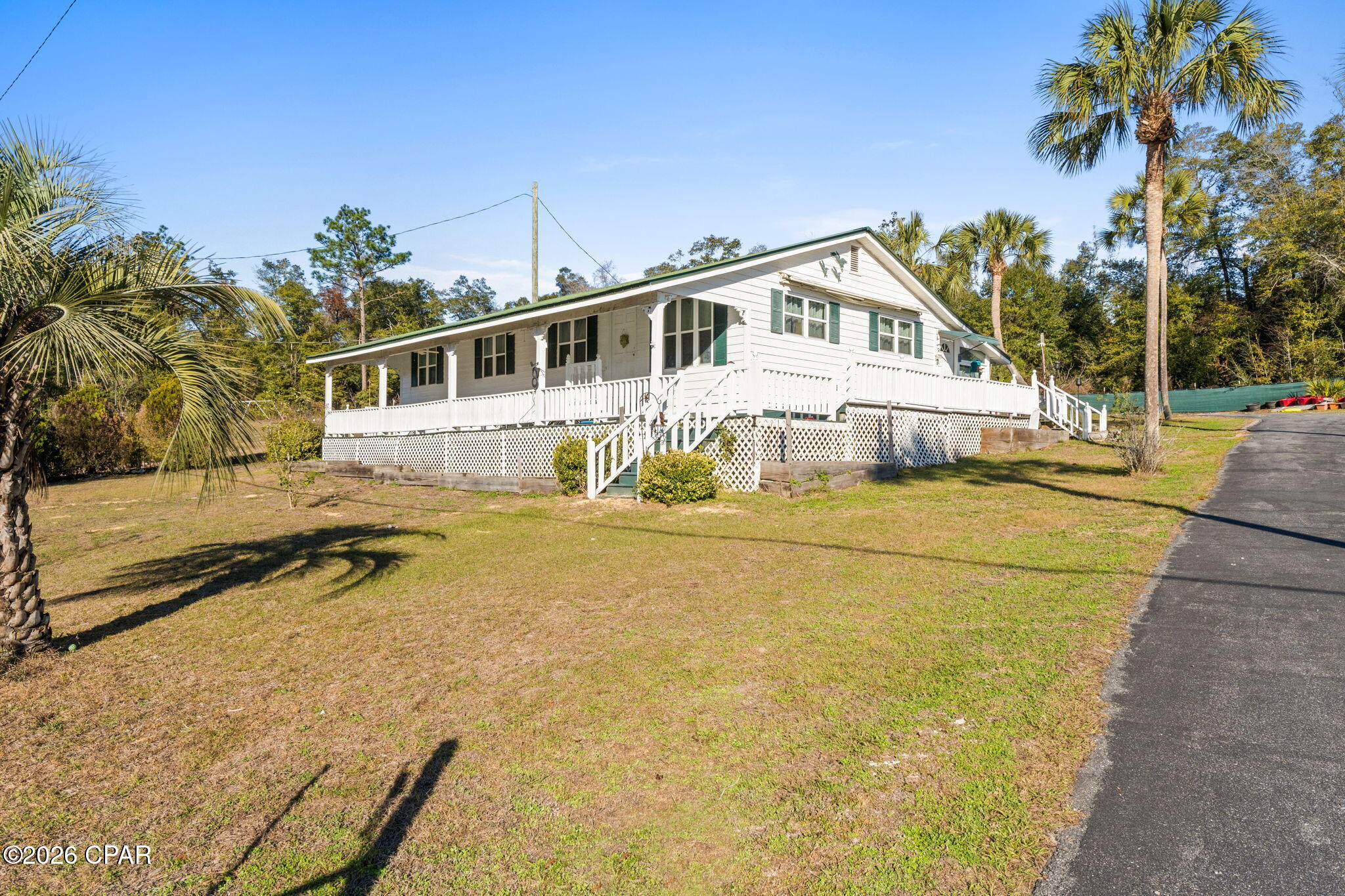 Tucked away in the peaceful Compass Lake area, this private country retreat offers the kind of space, flexibility, and quiet that buyers are searching for but rarely find.

Situated on a beautifully fenced property surrounded by mature trees and natural beauty, this thoughtfully maintained home combines comfortable everyday living with the freedom of a true Florida lifestyle. Whether you're looking for a full-time residence, multigenerational setup, weekend escape, or homestead-style property, this one offers exceptional versatility.

Inside, you'll find a warm and inviting layout with an updated kitchen, generous living spaces, and a spacious pantry for added convenience. Step outside and experience what truly makes this property special -- covered porches, peaceful outdoor living areas, fruit trees, open space to garden or roam, and the privacy that only country living can provide.

One of the standout features is the detached guest apartment, ideal for extended family, visitors, a private office, hobby space, or potential rental income opportunity.

Additional highlights include a 3-car garage, metal roof, fenced yard, and access to the Compass Lake community amenities nearby.

If you've been searching for a property with character, flexibility, and room to breathe -- without sacrificing comfort -- this is the one worth seeing in person.

Schedule your private showing today.