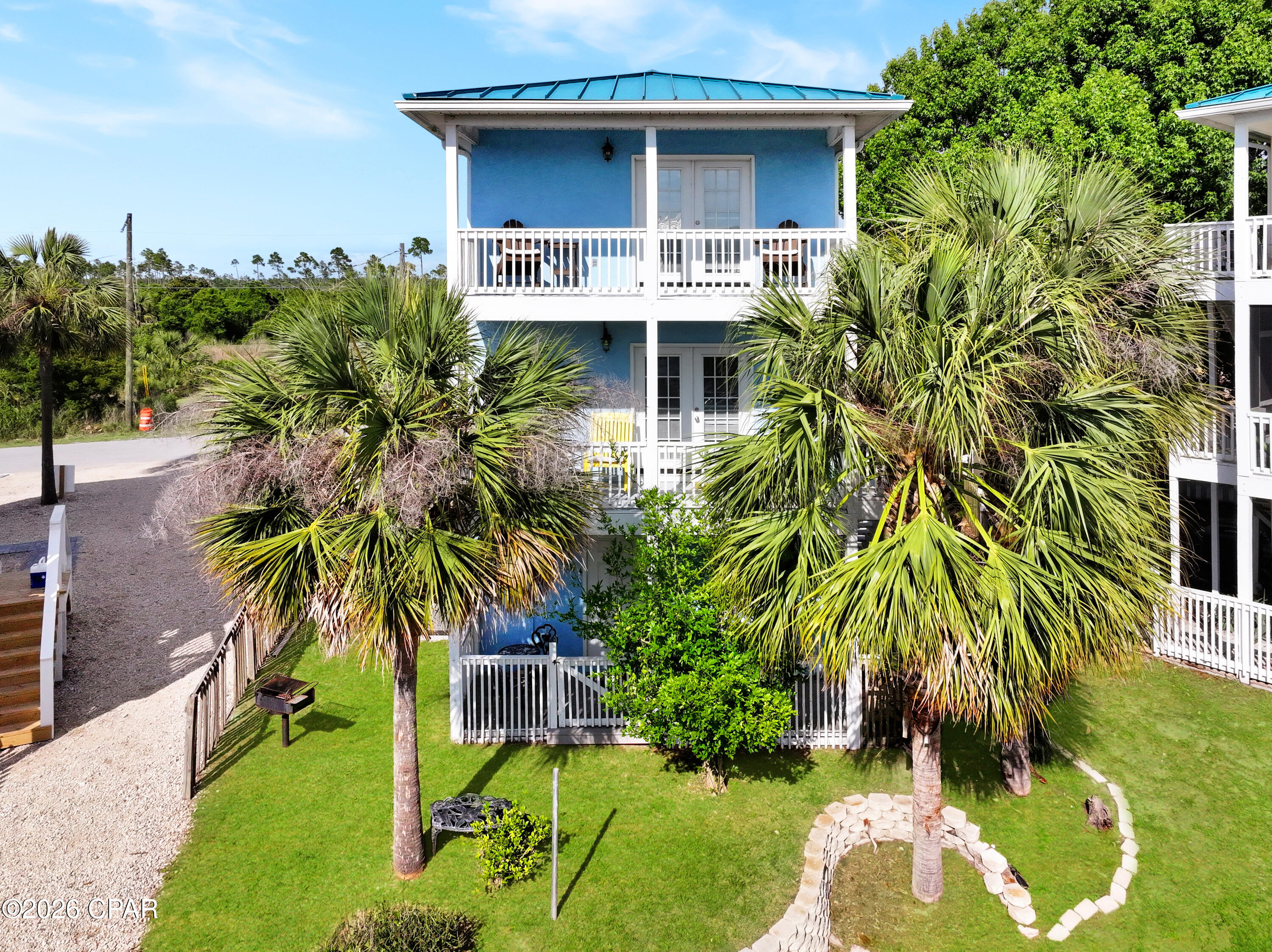 Welcome to your Canal Front coastal escape in beautiful Mexico Beach! This beautifully updated 3-story home offers the perfect beach retreat with a bright, open layout designed for easy living and entertaining. Just a short stroll to the Gulf, this house features 2 bedrooms, 2.5 bathrooms, this home is designed to maximize comfort while embracing coastal living. Enjoy spacious living areas, plenty of natural light, and outdoor spaces perfect for relaxing in the coastal breeze.  Situated on a canal-front lot, this property also features a seawall, adding to its appeal for those who love life near the water. Additional highlights include central HVAC, a standing seam metal roof, driveway, and fenced areas for added convenience.  Located just a short walk, golf cart ride, or bike ride to Mexico Beach's sugar-white sands, local restaurants, and shops, this property is ideal as a primary residence, vacation getaway, or investment opportunity. Experience the laid-back lifestyle Mexico Beach is known for in this move-in-ready coastal home.