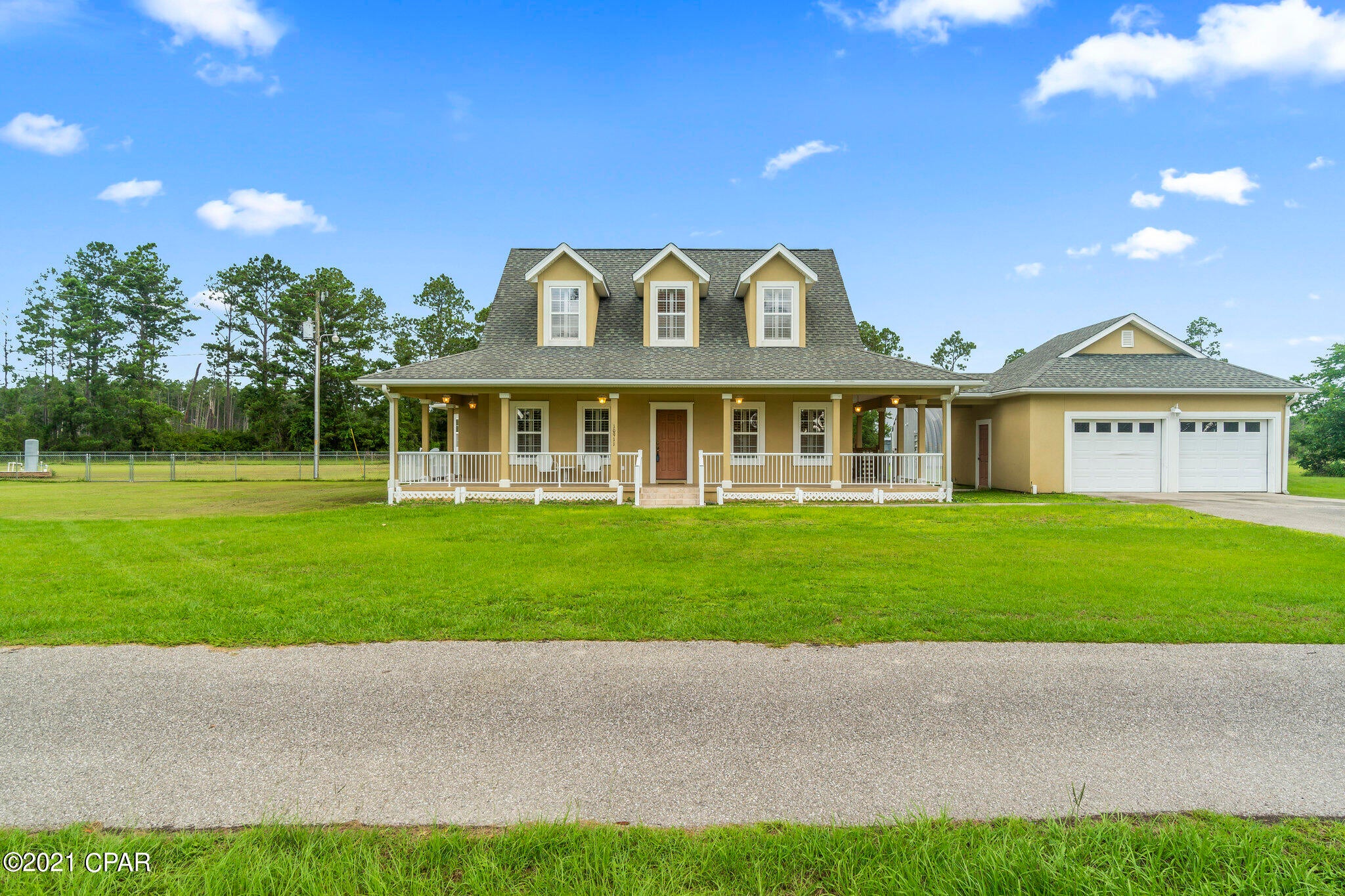 CURRENTLY UNDER CONTRACT, SELLER ACCEPTING BACKUP OFFERS. Custom built 3 bedroom 2 1/2 bath home. Huge 893 sq. ft. wrap around porch, detached garage w/covered breezeway and a huge Quonset hut on a concrete slab are just a few great features. The land has two deep water wells & one shallow well. The home features a 1st floor master bedroom & bath, custom storm shelter in the walk in closet & a 3 year old A/C unit. 2nd floor boasts a bonus living area, full bathroom, 2 bedrooms & a screened in balcony. Property also comes with a 3 year old generic generator that will power the entire home! Additional parcel w/2016 Sunshine Mobile home included. Parcel Id: 01087-005R Call today to schedule a showing. Age and sq. footage approximate, please verify.