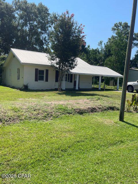 $135,000. This cute Florida cottage is ready for your family with freshly painted interior walls, pretty hardwood floors, decorative fireplace in living room (not functional), 2 spacious BR's, 1.5 bathrooms, dining room, large eat-in kitchen, and enclosed back porch. This comfortable home has 1171 sq. ft. of heated/cooled living space and a 125' x 143' lot inside the city limits, with water, sewer, electricity, natural gas, and garbage collection. If you  want to visit Florida's Capitol City (Tallahassee) or Panama City Beaches at the Gulf of America, you can be at either one in an hour or less. Put this charming home on your list of places to see because it won't last long at this price! $135,000.

THIS IS ALSO A GREAT LOCATION FOR A SMALL BUSINESS!!