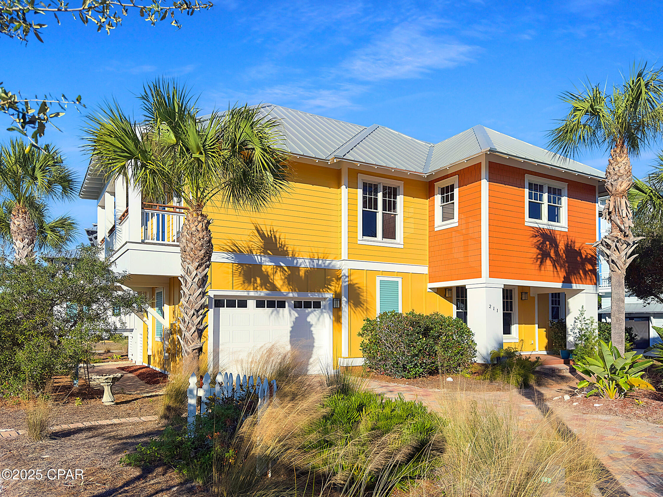 Welcome to this beautifully designed coastal retreat located in the gated Ovation community on North Cape San Blas. Built in 2015, this 4-bedroom, 3.5-bath beach-style home offers 2,273 sq ft of living space with a total of 3,196 sq ft under roof, thoughtfully crafted for relaxed coastal living and entertaining. Elevated on pillar/post/pier construction with a durable metal roof and HardiPlank siding, the home blends timeless coastal architecture with modern comfort Inside, you'll find hardwood and tile floors, soaring cathedral and beamed ceilings, recessed lighting, plantation shutters, and a gas fireplace anchoring the open living area. The chef's kitchen features a large center island, gas range, wine refrigerator, wet bar, quartz-style countertops, custom cabinetry, and beautiful wood-accent ceilings—perfect for hosting family and friends. The spacious primary suite includes a sitting area, walk-in closet, and spa-inspired bath with double vanities and a tiled walk-in shower Multiple covered porches and balconies invite you to enjoy peaceful bay views, coastal breezes, and sunsets year-round. The home is situated on a landscaped corner lot, offering deeded water access and community-maintained paved roads. Parking includes an attached garage and driveway space for up to four vehicles Residents of Ovation enjoy resort-style amenities including private Bay and Gulf beaches, community pool, boat dock, fitness room, clubhouse, BBQ areas, security gate, and underground utilities. Conveniently located near State Park beaches, and downtown Port St. Joe, this home offers the perfect blend of luxury, privacy, and coastal lifestyle.