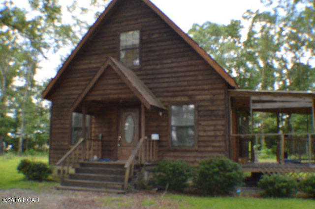 Very nice wood style two story house on a lovely piece of property with several landscaping plants and an old time water hand pump is in the yard functioning both as a novelty and furnishing a fresh sip of cool water. Home has open floor plan with kitchen/dining living area all open. master bedroom on 1st floor with full bath. Additional 2 bedroom with bath upstairs. Lots of Potential!!!!
