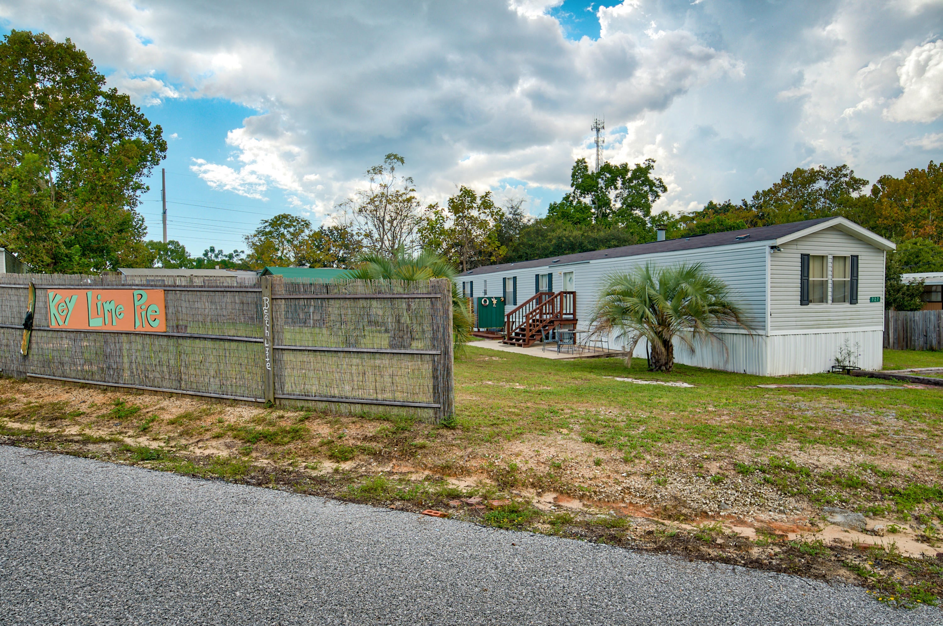 West -end opportunity! This mobile home sits on a beautiful corner lot.Plenty of parking (on both sides of Lot),out door shower, storage shed, &  2 driveways one with a carport. This Sweet home has a lot to offer: such as  a large living area with fireplace ,split bedroom, floor plan and a nice kitchen/dining are.,This home would make a great  investment piece or primary home. Sold furnished! Just bring a swim suit.The location is awesome! Going west from this area you have Lake Powell, 30A & Carillon Beach just minutes away.Going East you can get to Pier Park,The airport and of coarse the Beach in just moments.

Truly a nice investment piece.Come and check it out.