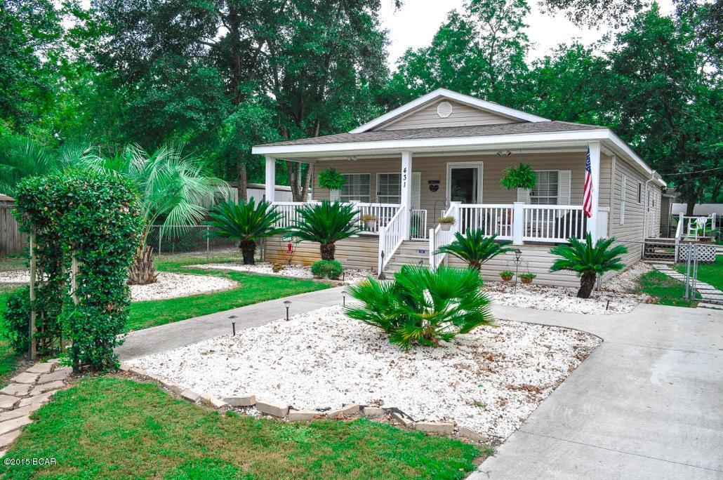 BOM - Buyers medical discharge was disapproved so this home is back on the market. This gorgeous 3 bedroom 2 bath home is in excellent, move in ready condition. Home features an open kitchen, formal dining, and a living room with fireplace. There is a large laundry room and pantry. Master bedroom has a walk in closet and master bath features double vanity, soaker tub, and separate shower. Relaxing front porch is perfect for late afternoon breezes. Home is on a large, privacy fenced corner lot with gorgeous landscaping, 2 storage sheds, a nice back deck, and 2 paved driveways. This home has a separate shallow well for the outside. Home is on public water and sewer. Some furnishings negotiable. Age, sq footage, measurements are approximate and buyer should verify if important.