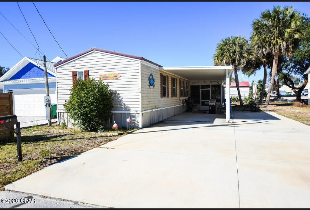 Furnished. All new plumbing in and under home. All new bathrooms with granite and walk in shower. Added double concrete driveway with drainage system. 2 car carport. Upgraded stainless steel appliances. New dishwasher and Water heater. Metal roof. Sunroom with enclosure windows and screens.