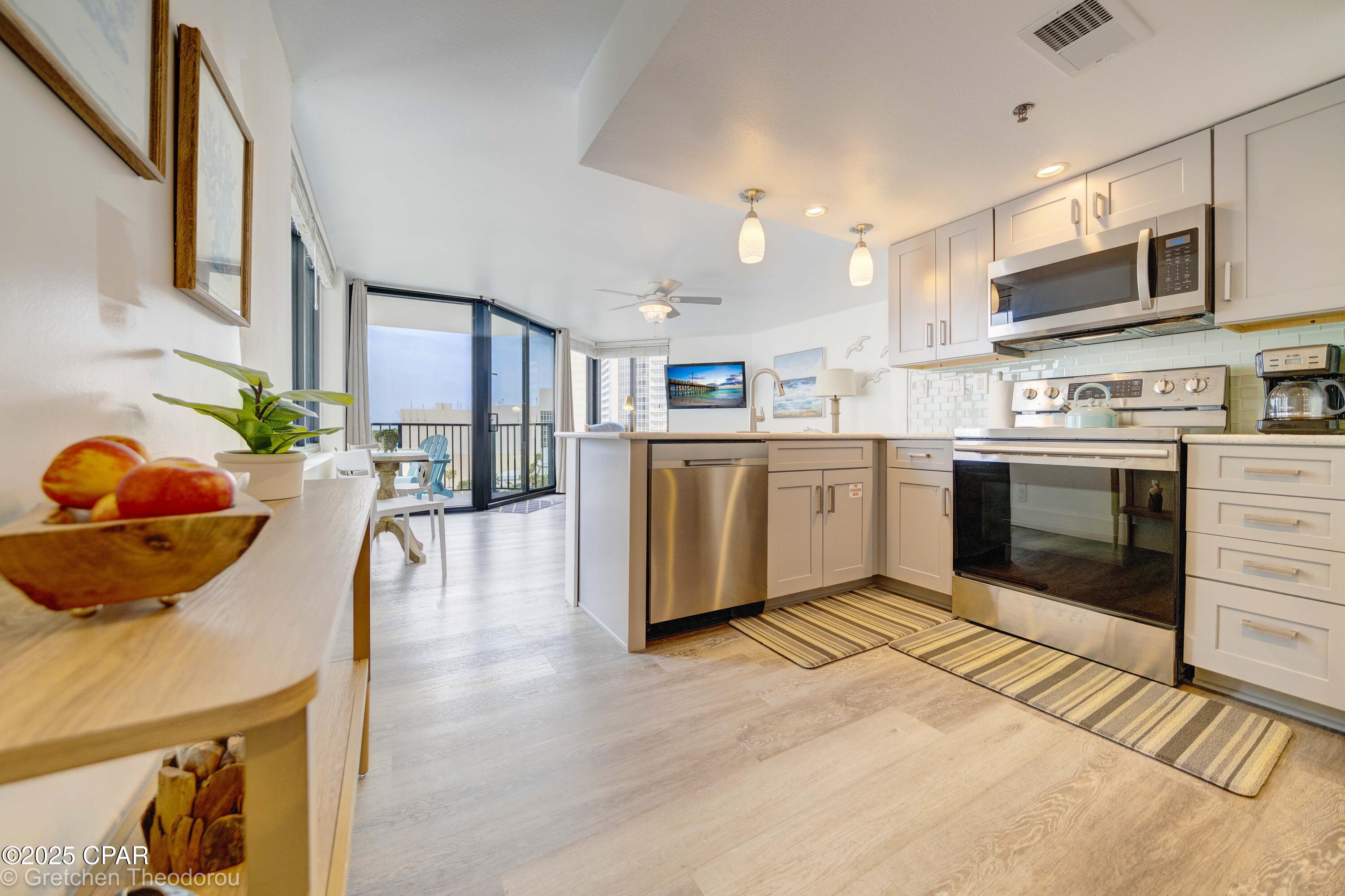 Oh my: Just got word from Management company of the rental income for the year. Very impressive! Escape to a world of paradise in this exquisite Gulf-front condo that transcends the ordinary and encapsulates the essence of coastal living. Immerse yourself in the serene beauty of breathtaking sunsets and pristine beaches, all within the embrace of your own private oasis. This renovated condo including a one year old HVAC unit, seamlessly blends modern elegance with coastal charm, offering a lifestyle of relaxation and refinement. The open kitchen is adorned with sleek quartz countertops, beautiful gray soft-close cabinets, and a welcoming
breakfast bar perfect for gatherings. The details show not only in the beautiful cabinetry but also in the over the top stainless appliances and deep single bowl sink. Step into tranquility as you enter your private bedroom with access to your bath with a delightful vanity and newer tub, meticulously tiled with a touch of perfection. You also have another
access to not only a private owner's closet but into the main living area perfect for entertaining with views of the Beaches and the lights of Panama City Beach and its nightlife. Walk to Pineapple Willies, Walmart, Waffle House and a number of fast food and sit down
restaurants and soon... Tootsies, where the old iconic Spinnakers was located. There are three pools with one heated. The center pool has just been totally redone!  Call your favorite Realtor and come check out this condo!!
