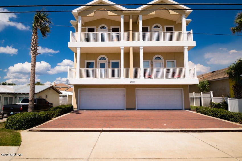 Vista Del Mar is the perfect beach getaway. Situated on a quiet stretch of the beach just one row back from the gulf, this spacious condo has it all. No need to worry about parking - this condo features its own private 2-car garage. Stunning sunset views over the Gulf can be witnessed from the kitchen, living/dining area, and private balcony. This unit is tastefully furnished and rental ready with a proven rental history. Interior upgrades include beautiful kitchen with wood cabinets, stainless steel appliances, and granite countertops;  luxurious master bath featuring tile floors, separate walk-in shower, and whirlpool tub. If you are looking to enjoy the beach without the crowds, and do not want to be in a high rise condo, this property is for you! Buyer to verify all dimensions.