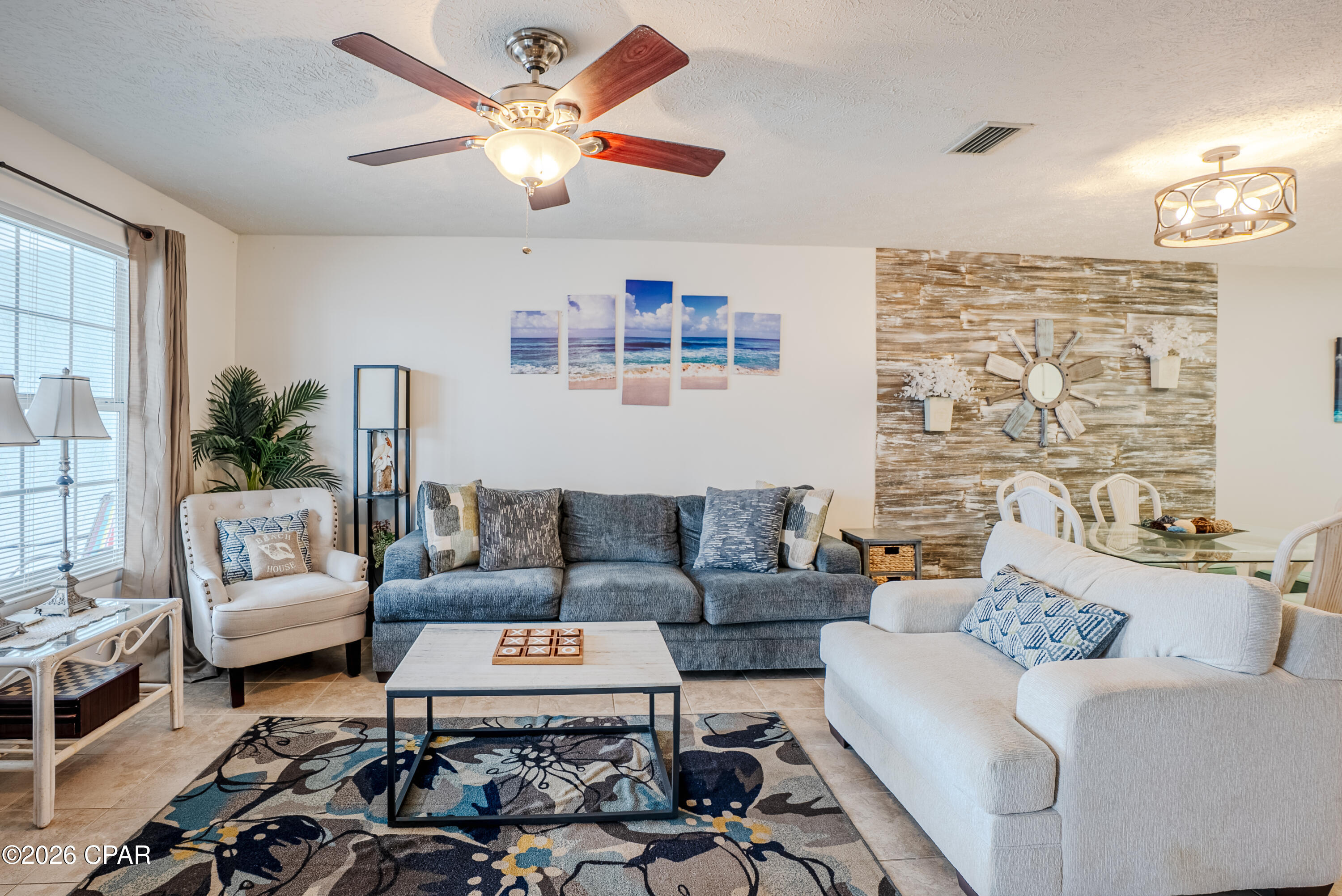 **Great Price Adjustment** Welcome to the World's Most Beautiful Beaches!!This beautifully maintained 2-bedroom, 2-bath coastal retreat features an open-concept floor plan designed for relaxed beach living. The kitchen offers very nice finishes and flows seamlessly into the living and dining areas, creating an inviting space for entertaining or everyday use. Unique wall décor adds character and a distinct coastal charm throughout the home.
Enjoy mornings and evenings on the covered porch, perfect for unwinding after a day at the beach. Located just a short stroll from the sugar-white sands of Panama City Beach, this property is ideally positioned near Pier Park, popular dining spots, and entertainment. Situated in the highly sought-after West End, this home provides close proximity to 30A lifestyle amenities--without the 30A price tag.
Whether you are seeking a short-term rental investment or a personal beach getaway, this property offers versatility, location, and strong appeal in a proven rental market. Condo is being sold fully furnished  New water heater 2024, new garbage disposal 2025, new electrical panel 2023.
 HVAC serviced 4/6/2026. HOA includes water, trash, exteriorinsurance,flood insurance, sewer and internet/cable. Sellers have a one year home warranty  on condo.  Call your agent today to see this great unit.