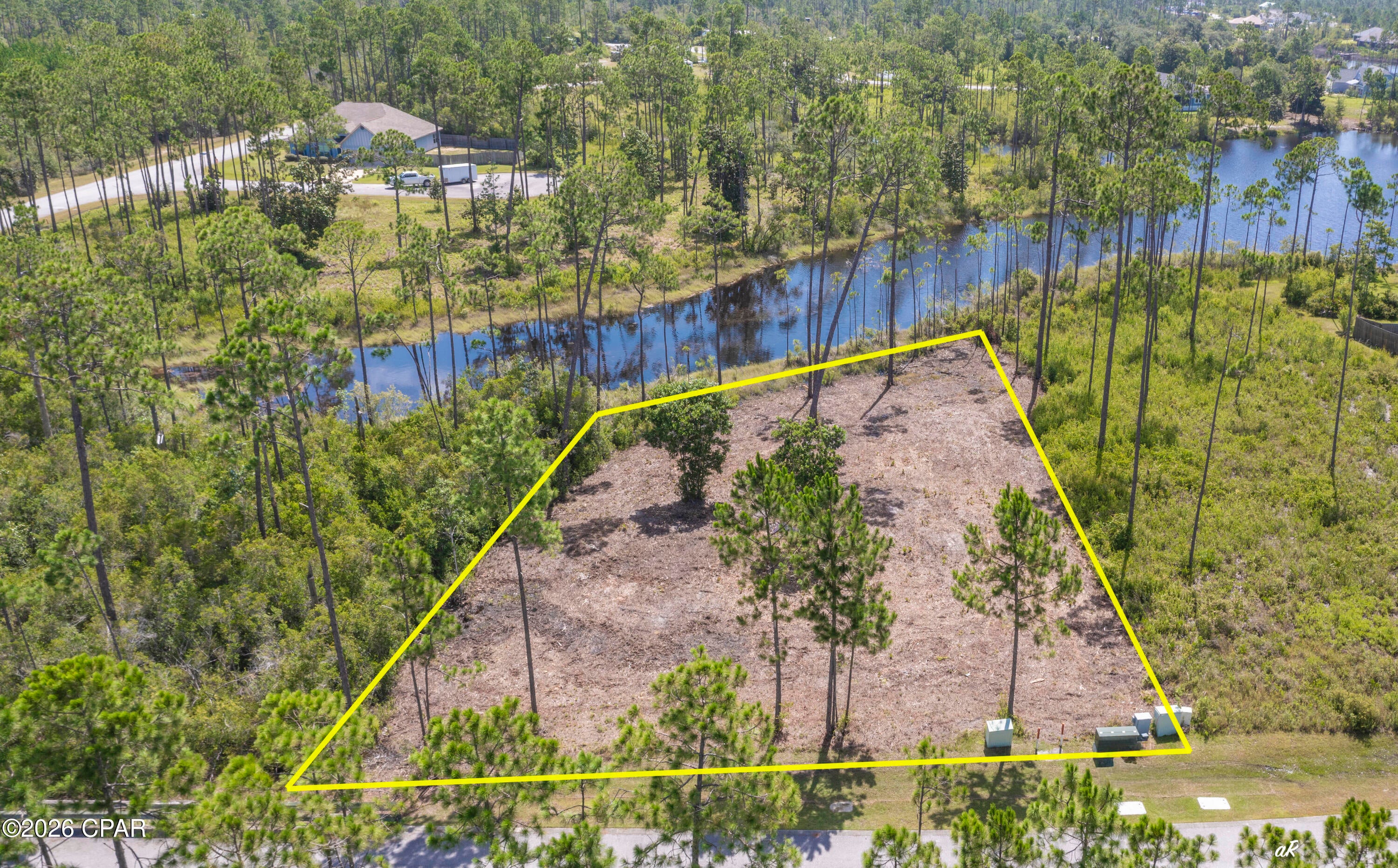 Discover the perfect setting to bring your dream home to life in the prestigious gated waterfront community of Laird Point. This cleared homesite is ready for your vision, saving you valuable time and preparation costs while offering an exceptional location surrounded by nature.

Enjoy direct access to the lake, where peaceful mornings can begin with kayaking or fishing and evenings can end with breathtaking waterfront sunsets. The community's underground utilities preserve the natural beauty of the neighborhood, while the gated entrance provides added privacy and security.

Conveniently located just minutes from Tyndall Air Force Base, as well as shopping, dining, and everyday conveniences, Laird Point offers the ideal balance of quiet coastal living and modern accessibility.

Whether you're designing your forever home, a second residence, or an investment in one of the area's growing waterfront communities, this property presents an outstanding opportunity. Experience the lifestyle you've been looking for and see why Laird Point continues to attract homeowners seeking both serenity and convenience.

Contact me today for additional information or to schedule your private tour.