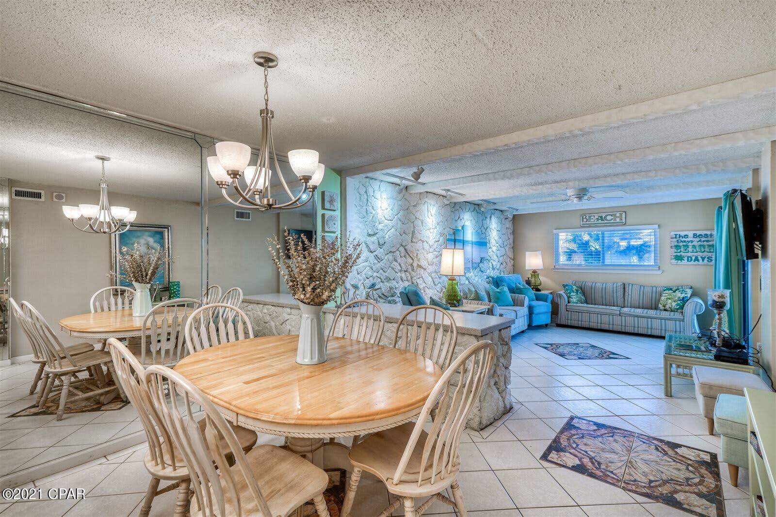 This is a well-maintained and truly unique 3 bedroom unit in the desirable Regency Towers complex. Located on the east end of PCB, this 2nd floor unit provides both a view of the water and easy access, so say goodbye to those long elevator lines. It features vinyl plank flooring installed in 2020, a new ac in 2018, water heater in 2017, and a new fridge in 2020. Custom tile throughout with decorative tile inserts and a terra cotta tile patio are other special features of this one-of-a-kind unit. A distinctive rock feature wall anchors the large living area. It is one of only a handful of units with and enclosed window patio for your year round enjoyment. The unit comes fully furnished and is 100% rental ready for up to 10 guests.