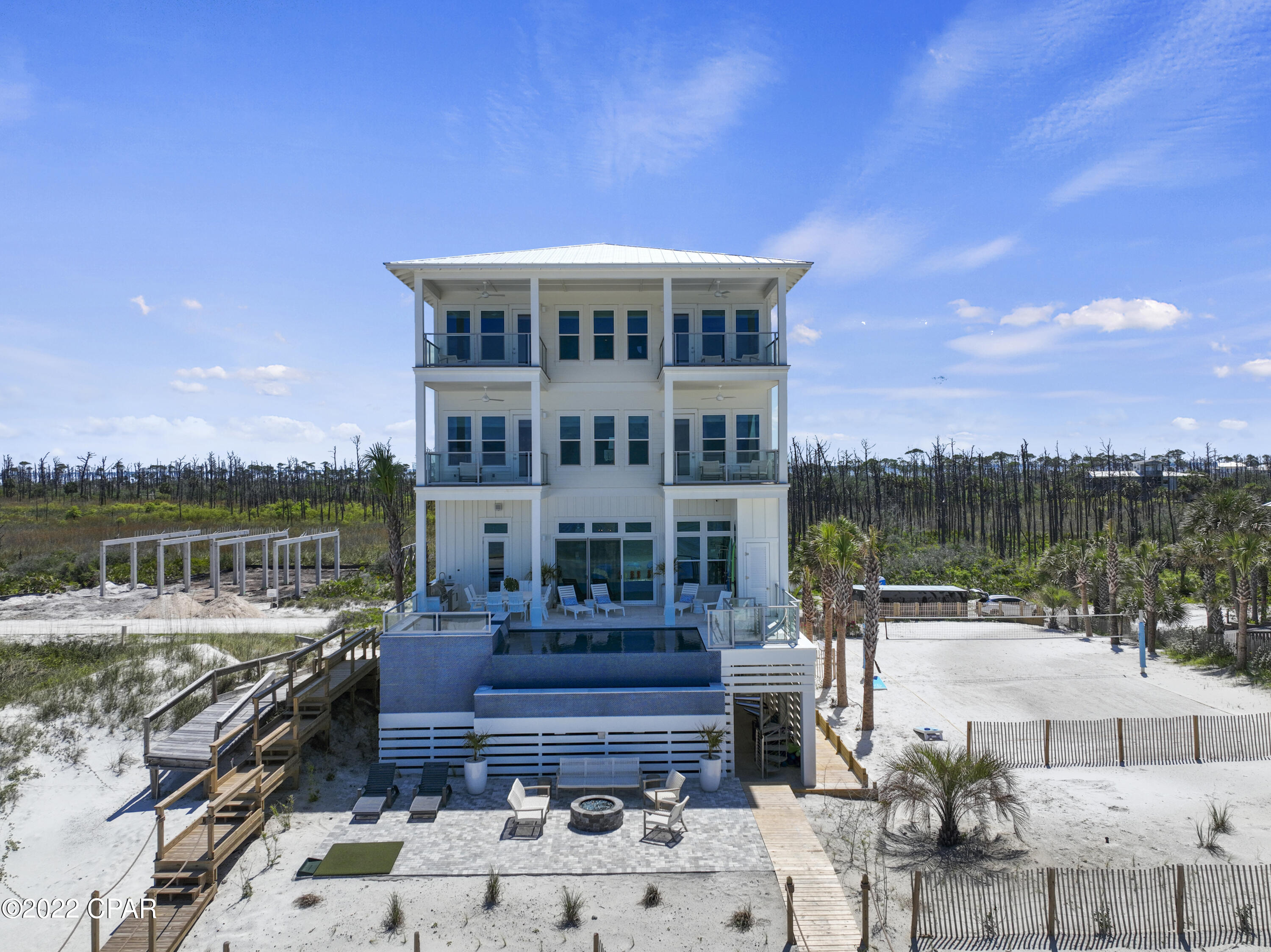 Welcome to ''Making Memories on the Cape''. Prominently placed in the gated luxury community of Secluded Dunes, this home is perched at 30 feet above sea level encompassing 56.8 feet of gulf frontage. This home offers resort-style amenities, breathtaking views and finishes, commercial quality construction by a respected and local builder, and is made all the more sublime by the architectural design of a 30A architect. Boasting 9 beds, 9 full and 2 half baths, this home is equipped to sleep up to 28 people, making this a great option for those with large families and for those seeking ROI. Completed at the end of 2021, this architectural masterpiece rivals all homes along the Emerald Coast, yet provides the tranquility and the serenity we long for! INVESTMENT ALERT: This property is on track to gross over $500k in revenues for 2024! Equating for 4 weeks of owner usage (40k income plus), this home realizes a 6% CAP Rate, which is nearly impossible for a waterfront home anywhere along the Florida Panhandle! Look for the proforma in the docs section of the listing.