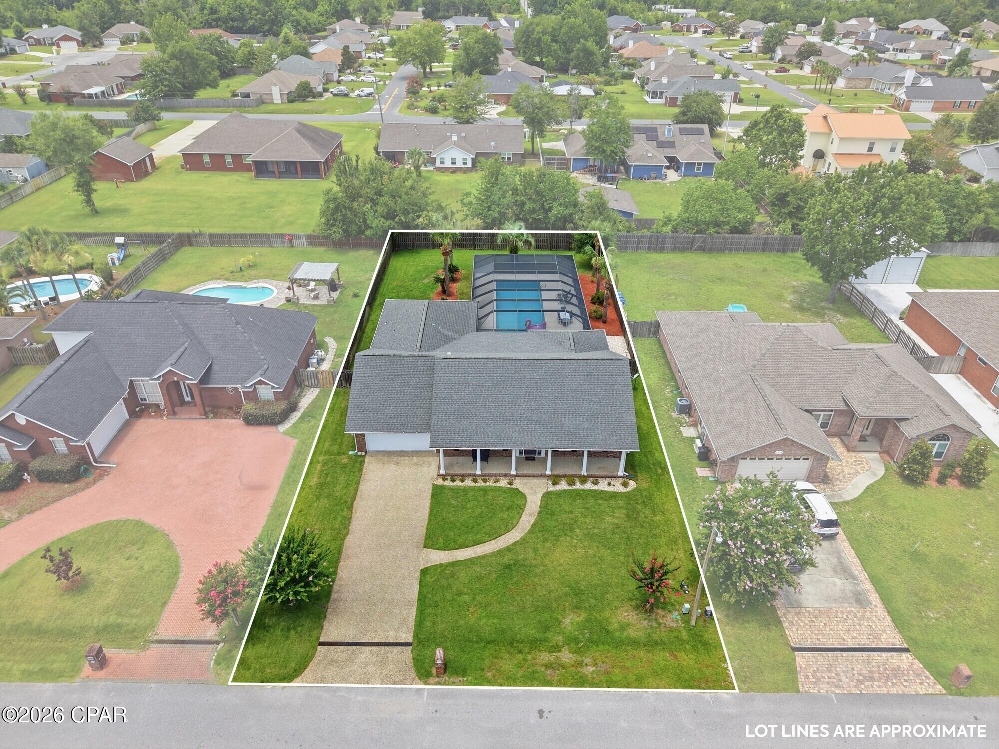Gorgeous TRUE custom-built all-brick home in one of Lynn Haven's most sought-after neighborhoods with no HOA -- Huntington Ridge in College Point. Overlooking the neighborhood pond, this beautifully designed home offers nearly 2,700 square feet (10 feet tall ceilings) with 4 large bedrooms, 3 full baths, a dedicated office/flex room, formal dining, an oversized family room, and a private huge screened pool-all wrapped in timeless custom craftsmanship.

What truly makes this home exceptional is the care that's been poured into it. After Hurricane Michael, the home was professionally rebuilt from the studs following complete mold remediation, giving today's buyer the rare combination of classic custom construction with the confidence of extensive modern improvements.

Inside, you'll immediately notice the details that separate this home from the rest-custom cabinetry throughout, extensive crown molding with double crown accents, plantation shutters, granite countertops, new luxury wide plank flooring, a double convection oven, gas fireplace, updated lighting, renovated bathrooms, and a living room wired for 7.2 surround sound.

Step outside to your own private backyard retreat featuring a fully renovated screened pool with Blue Quartz plaster, new equipment, new pool lighting, a professionally refinished pool deck, lush landscaping, privacy fencing, and plenty of room to entertain.

Thoughtfully updated for comfort, efficiency, and peace of mind:
Newer 30-year architectural roof
Newer HVAC system
Newer hot water heater
Updated kitchen appliances
Spray foam attic insulation & energy-efficient windows
Beautiful new flooring and carpets throughout in 2020
Updated bathrooms with coordinating countertops
Fresh sod, professional landscaping & irrigation on a dedicated meter
Finished garage with additional attic storage
Annual transferable termite bond

Located in one of Lynn Haven's premier custom-home communities, this home offers the perfect balance of quality construction, thoughtful upgrades, established charm, and everyday convenience near top-rated schools, shopping, dining, Tyndall Air Force Base (20 min), Navy Base (20 min) and more!