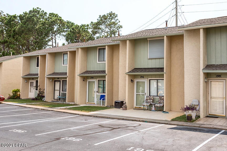 Beautiful 2 bedroom/1.5 bathroom townhome in sought after Gulf Highlands Beach Resort! Recently painted with hardwood and tile throughout - no carpet! Master bedroom upstairs has TWO closets instead of one. Roof is 2 years old. Step out on to the back patio or balcony and enjoy plenty of space! You can pull right up to your front door with two designated parking spaces- no elevators or parking garages. Unit has never been rented, but is in a great location to be a vacation rental! Gulf Highlands has great amenities for guests - including swimming pools, tennis courts, and shuffleboard courts.