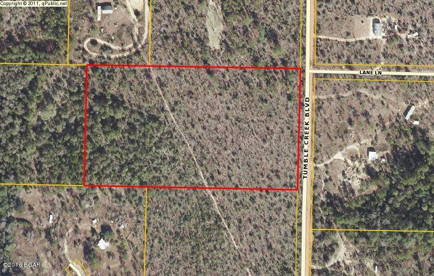 Looking for 10 acres of secluded, unrestricted land? Here it is. Located in the Tumble Creek area of the Country Oaks community. Land has no deed restrictions and is suitable for new construction or manufactured homes. Aerial view shows possibility of a spring in the back corner.