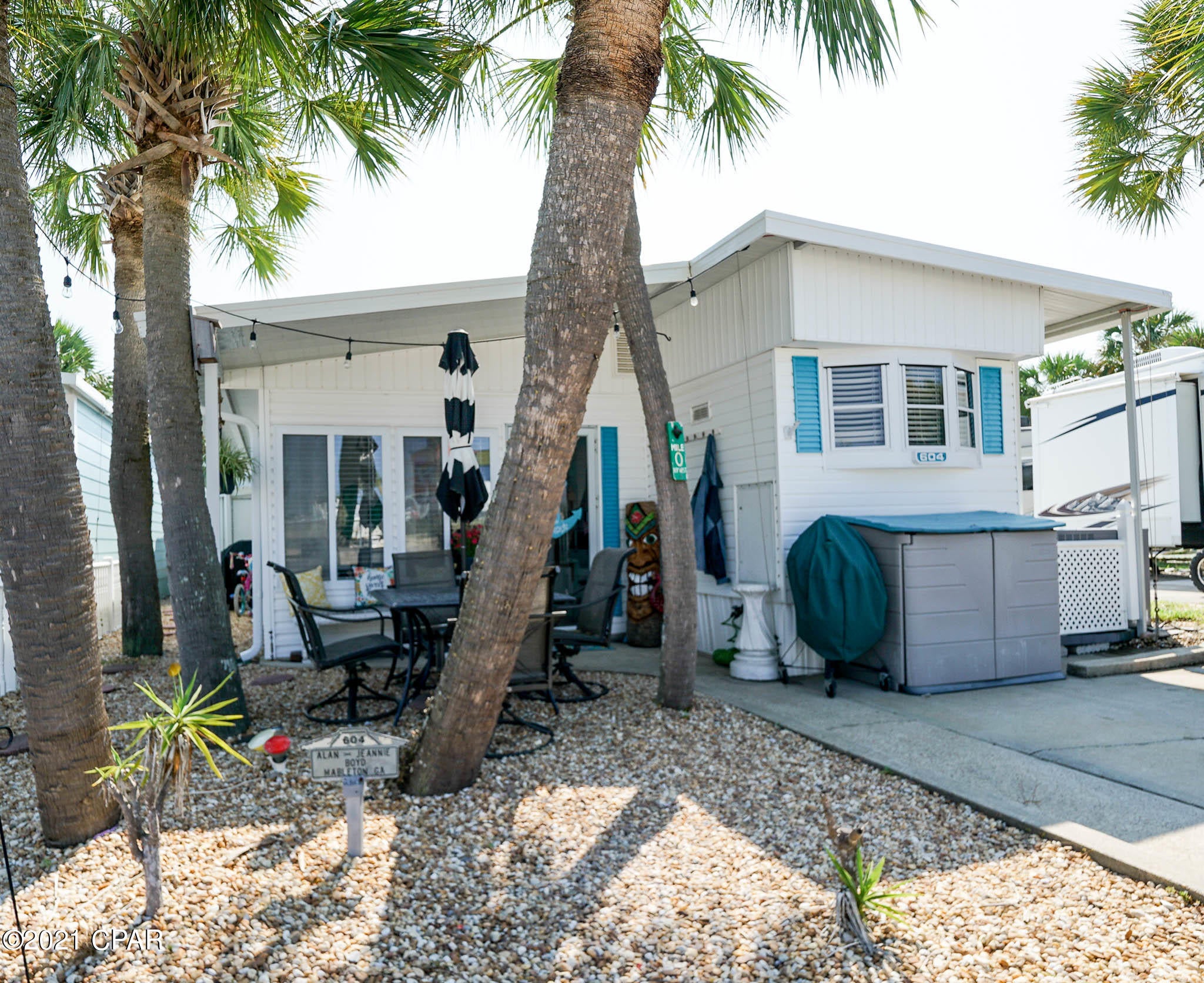 Check out this adorable Venture Out home! This 2 bedroom 1.5 bath home is super charming and move in ready!  Fantastic front porch and with nice shade perfect for relaxing after a long day at the beach! New HVAC system added recently. Great for investment or make this your second home. Venture Out is a golf cart community that has exploded with popularity recently... With 300' on the beautiful pristine beaches of the Gulf of Mexico and 1,000' on the Grand Lagoon. Venture Out has something for everyone. With 2 pools, fishing pier, boat ramp, mini golf, children's play ground and much much more!