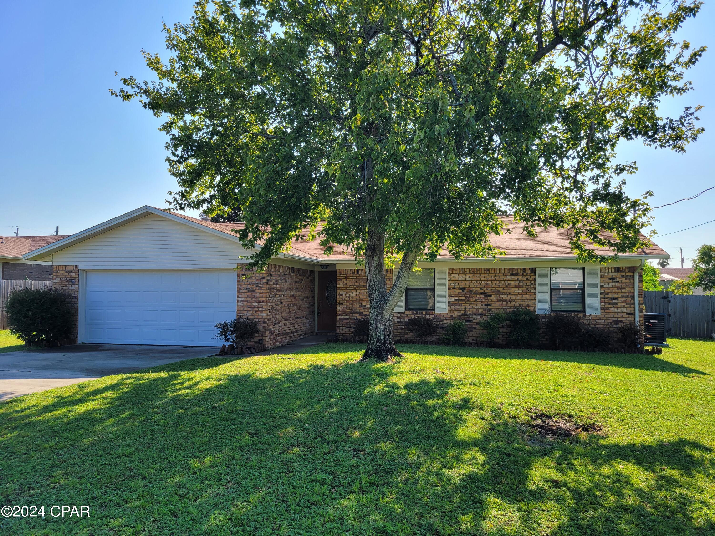 NIce 3 bedroom 2 bath home with 2 car garage.  This home features a vaulted ceiling in the living area, NON-operational fireplace, formal dining, breakfast area in the kitchen, master bath with large garden tub, LVP flooring in the common areas and carpet in the bedrooms.  Large lot with privacy fenced backyard, large open patio, shed AS IS for tenants use.  Teco gas heat and tankless water heater.  Sprinkler meter on separate meter with backflow prevention.  Non-Smokers and NO PETS!
