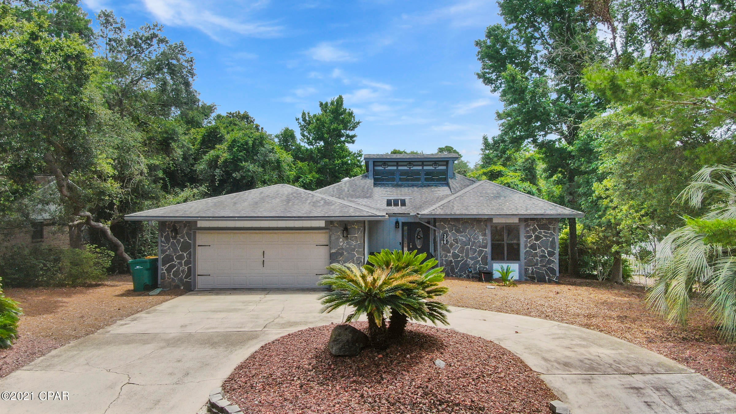 NEW ROOF!!  Located in the desirable Bluewater Bay Area of Niceville, this unique home will draw you in with its beautiful floors and sunken family room featuring a wood burning fireplace. Three bedroom, two bath split floor plan. The Master Bedroom and Bathroom has his and her sinks and closets, a spacious shower. Enter the Florida Room from the Master Bedroom, Family and Kitchen areas. Walk out onto a huge back deck perfect for grilling and entertaining. Water heater and A/C are 1 1/2 years old. Call your agent today to schedule a visit. All ages, measurements and room sizes are approximate. Please verify if important.