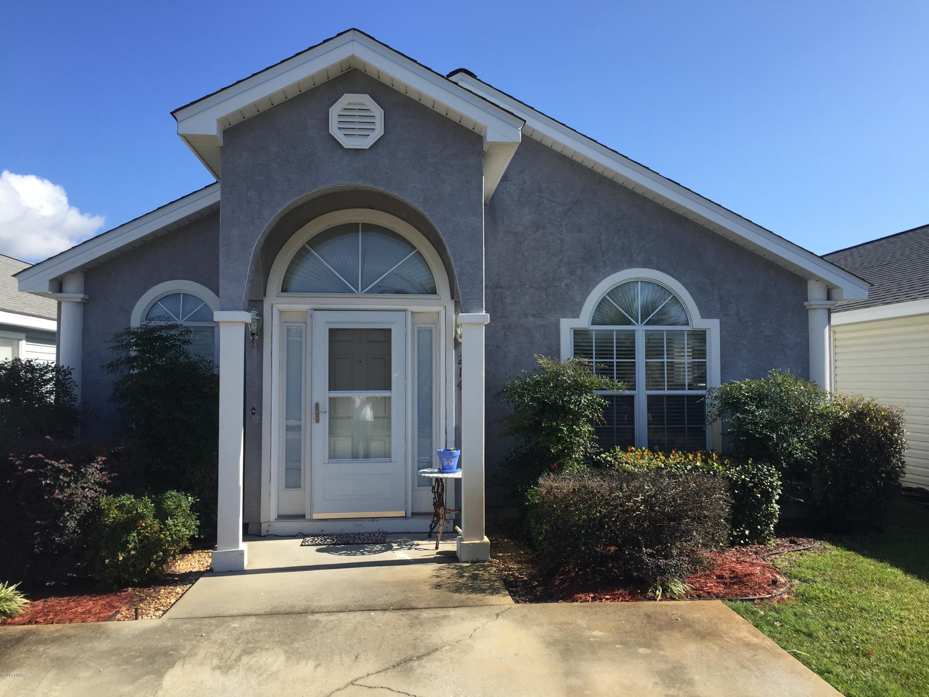 USDA 100 % Financing! Beautiful home in Palm Cove. Gated community located in the heart of Panama City Beach, very close to the world's most beautiful beaches. This newly upgraded three bedroom two bath home is a must see. It is the standout in this beautiful neighborhood. The recently added granite countertops and additional cabinetry and counter space in the kitchen are absolutely stunning, while creating a most functional space. The flooring throughout the home has been replaced with hardwood with the exception of the bathrooms and laundry room that have been upgraded with a gorgeous ceramic tile. And this is just the inside! Open the back door to find a beautiful, wooden deck and cozy yard made private by a 6 foot vinyl fence. This home is a big step above the rest in this perfectly lo cated neighborhood.neighborhood. Palm Cove is minutes away from Pier Park, Publix, the Hathaway Bridge, and the beautiful white sandy beaches of Panama City Beach,  while being positioned perfectly to avoid all that pesky tourist traffic. Come and see for yourself why this home is the one for your Family.
