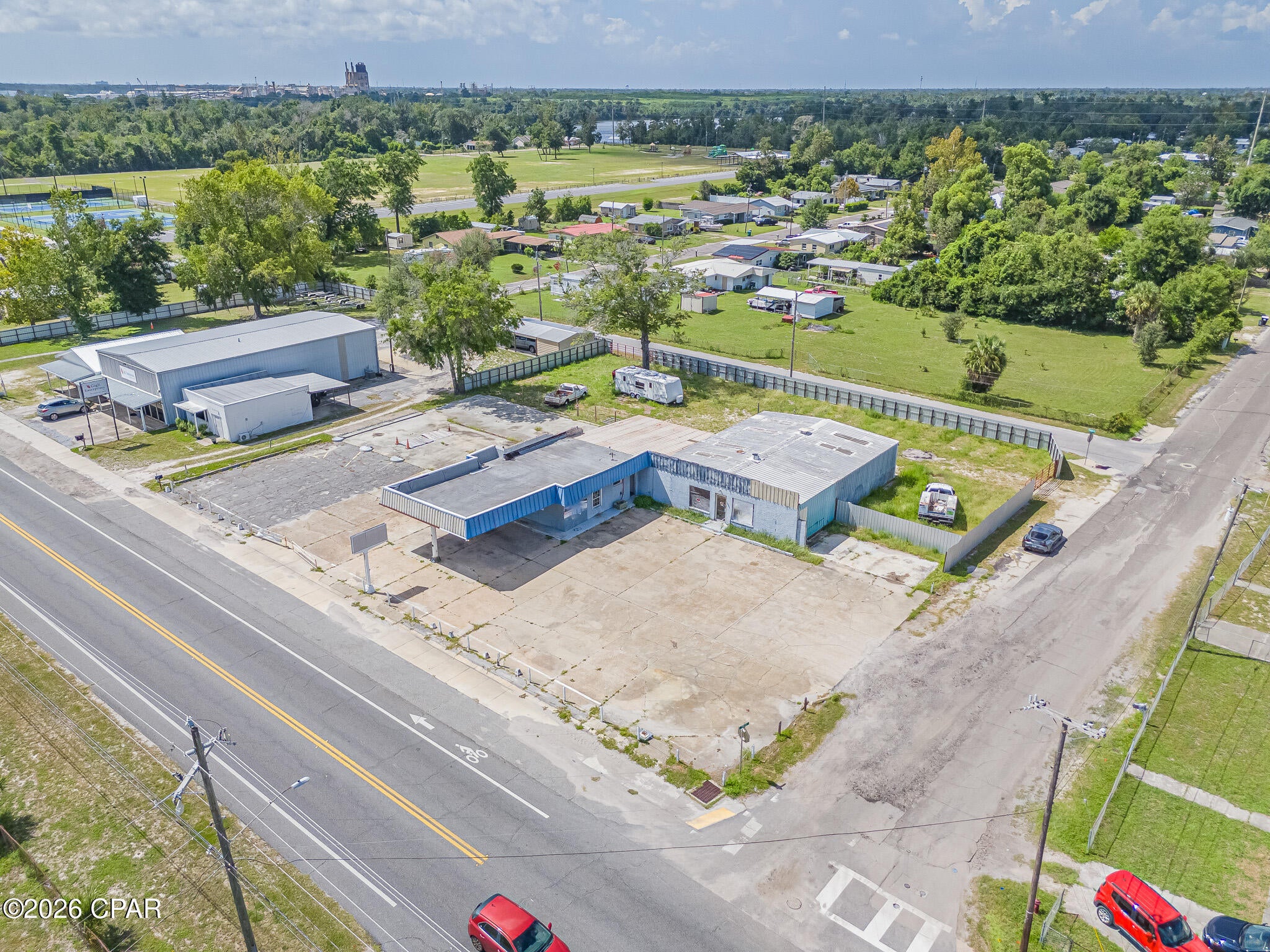 **High-Visibility Highway 98 Commercial Redevelopment Opportunity** Excellent commercial redevelopment opportunity on approximately 0.65 acres with an impressive 175 feet of frontage along East Highway 98 in Panama City. This highly visible property currently features two commercial buildings, including a 2,340-square-foot vehicle service building and an approximately 2,100-square-foot building identified by the Property Appraiser as vehicle sales/retail. The site offers extensive concrete parking and a prominent location along a well-traveled commercial corridor, providing excellent exposure for a future development or commercial venture. With substantial highway frontage, existing improvements, ample paved parking, and a strategic Panama City location, this property presents an attractive opportunity for investors and developers looking to redevelop or reposition a high-profile commercial site. The existing buildings may provide potential interim use while plans for redevelopment are explored. Buyer to verify zoning, permitted uses, development potential, dimensions, utilities, and all other property information with the appropriate governmental authorities.