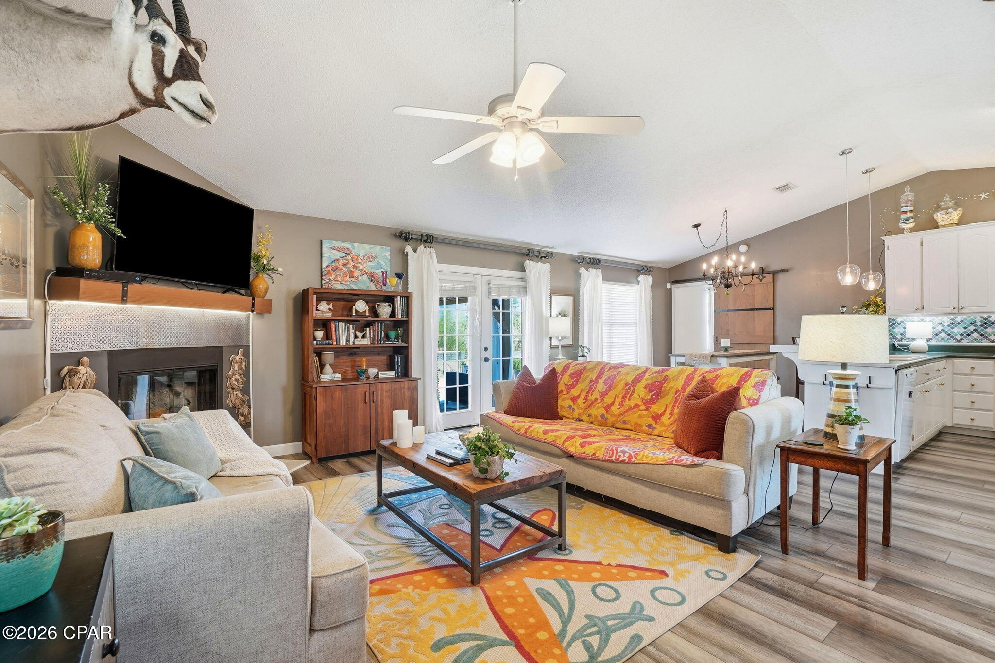 Welcome to your beautifully renovated 3-bedroom, 2-bathroom country oasis tucked away on a quiet waterfront lot. With minimal traffic and a golf cart-friendly neighborhood, this country gem offers the perfect blend of privacy, convenience, and lifestyle. Step inside to discover a spacious open-concept main living area filled with natural light. A lovely fireplace serves as the focal point of the living room, flanked by French doors that lead directly out to a large deck overlooking the pond. In the dining and kitchen area, you'll find a beautiful backsplash, spacious pantry, and convenient breakfast bar--perfect for simple meals or a buffet station when entertaining family and friends. The home has been thoughtfully updated from top to bottom featuring: New roof, air conditioner, siding, LVP flooring, fresh interior paint, designer backsplash, and updated lighting fixtures. The outdoor space is just as impressive! Enjoy spending time on your wonderful open deck, spacious back yard, or feeding the fish and turtles down by the pond. There is even a garden area and a citrus tree for those who love to grow their own produce. Whether hosting summer gatherings or enjoying a quiet evening under the stars, this backyard truly delivers. Additional highlights include a large Primary Suite w/ a Jacuzzi tub and walk-in closet, a double garage, a sprinkler system, a Culligan water filtration system, a corner lot location, and a split bedroom layout offering both comfort and functionality to everyday living. Like to fish? There are 2 boat ramps less than a half mile away. Launch your boat, jet ski, or kayak into Deerpoint Lake and enjoy some of our area's best freshwater fishing! Homes like this -- updated, move-in ready, no HOA, and no flood insurance required -- don't come along very often. CALL TODAY FOR MORE INFORMATION!
