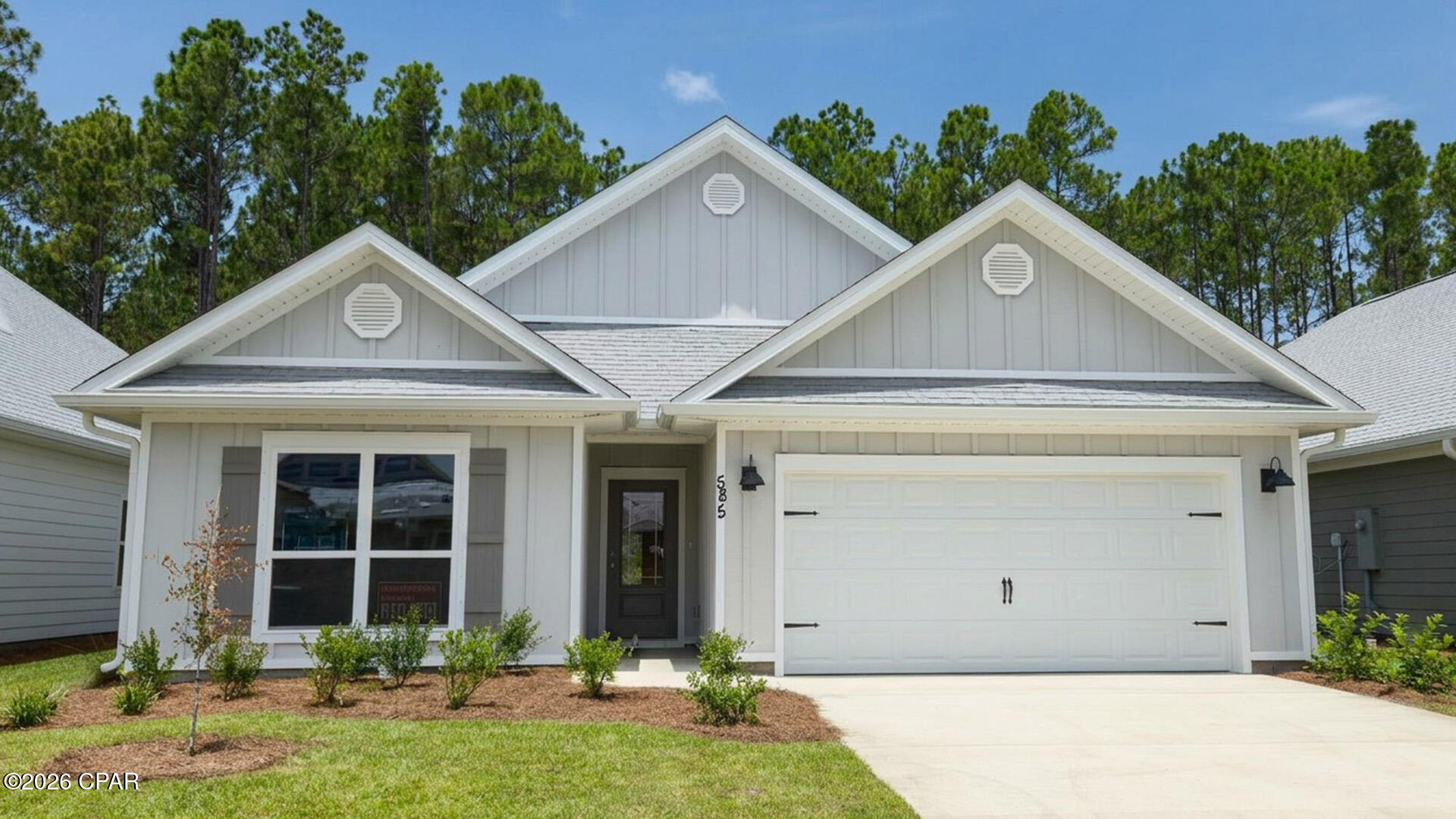 Welcome to 585 Hancock Way at Bayside at Ward Creek in Panama City Beach Florida. This home is ready for move in and features the Delray floorplan. As you walk into the home you will find two bedrooms off the entry hall with a full bath in between. The laundry room located across the hall is spacious and offers space for storage if needed. There is a fourth bedroom that could serve as an office space/ flex room/ bedroom next to the laundry room. The heart of this home is the spacious living area that is open to the kitchen. 

This floor plan flows seamlessly with beautiful EVP flooring throughout the main living areas and carpet in each bedroom. The kitchen is equipped with brand name stainless appliances including a smooth top stove, microwave, and dishwasher as well as a center island with lower cabinetry. The beautiful white cabinetry compliments the elegant quartz countertops and offers a bright feel to this spacious home. 

The primary bedroom is located at the back of the home offering a private retreat and it features an ensuite bathroom with EVP flooring, quartz countertops and beautiful white cabinetry. The bathroom is designed with two spacious closets, a large shower with glass enclosure and a dual sink vanity.