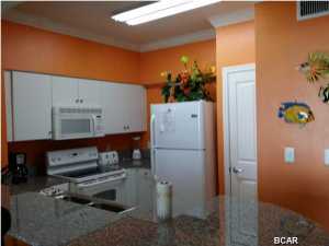 This is everyones favorite one bedroom floor plan with the master overlooking the Gulf. Beautiful furnishings with several upgrades including tile throughout, owners have added door to bunk room and also added door in master bedroom. Conveys with parking space 530. Please check out the Shores of Panama with the best location on the beach. Almost 500 feet of beachfront, 14,000 sq. ft. lagoon style pool, workout facilities,indoor heated pool, 2 day spas, tiki bar and grill. You can't beat the ammenities. You'll notice the difference the moment you drive in with our covered parking and entranceway. Please don't miss the opportunity to own at the best resort in PCB with the lowest prices