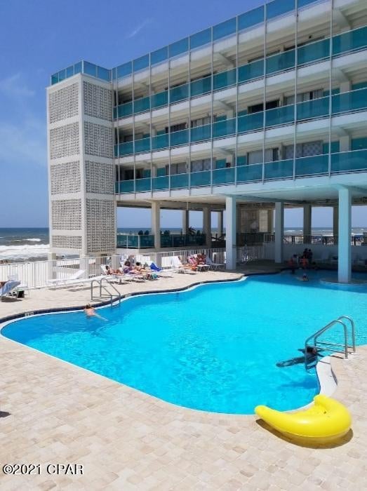 Character and charm with this studio condo in the historic Fontainebleau Terrace. This unit is beachfront, recently remodeled and rental ready. Updates include open ceilings, LVP flooring, cabinets, appliances, all new fixtures and furniture. This condo grosses approx $40,000 per year in rental income and stays rented year round. Fontainebleau Terrace offers, newly remodeled pool, two large open terraces, gym, owners lounge with fully equipped kitchen, grills, onsite laundry and elevators. The HOA fees include all utilities. Call to see this condo before its gone.