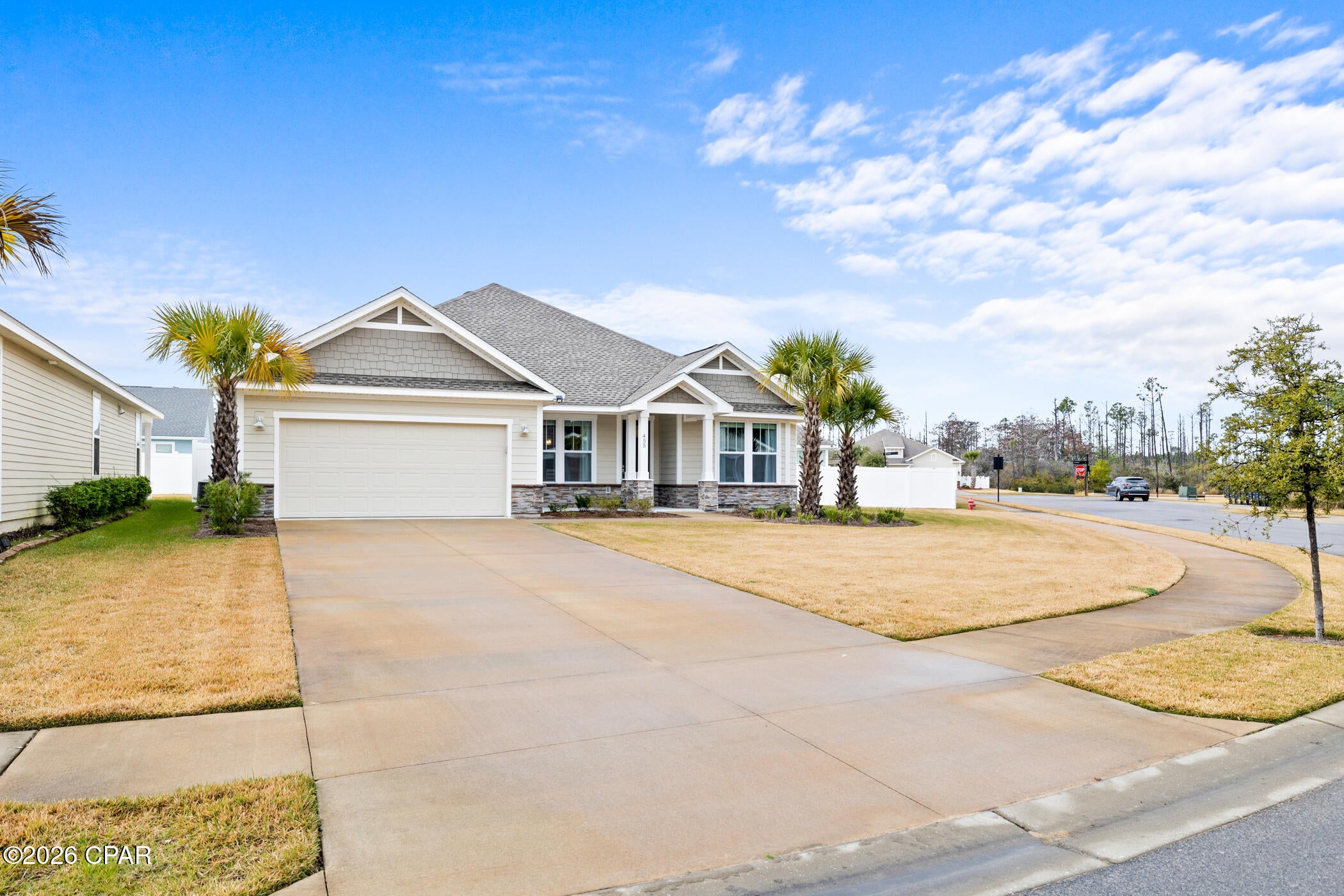 Welcome to this beautifully maintained, one-owner home in the desirable Breakfast Point community! Built in 2023 by Southern Coastal Homes, this coastal-inspired residence offers 4 bedrooms, 3 full bathrooms, and 1,958 square feet of thoughtfully designed living space.

Situated on a corner lot, the home features an open-concept floor plan with a light-filled great room, separate dining area, and a well-appointed kitchen with a center island, custom cabinetry with soft-close drawers, and stainless steel appliances. The spacious primary suite includes a tray ceiling, double vanity, tiled walk-in shower, and large walk-in closet.

Enjoy the Florida lifestyle from the covered front porch or the newly screened-in back porch. The fully sodded yard includes an irrigation system, while the finished two-car garage provides plenty of parking and storage.

Located close to Gulf beaches, shopping, dining, entertainment, and Pier Park, this home offers comfort, convenience, and an ideal Panama City Beach location.