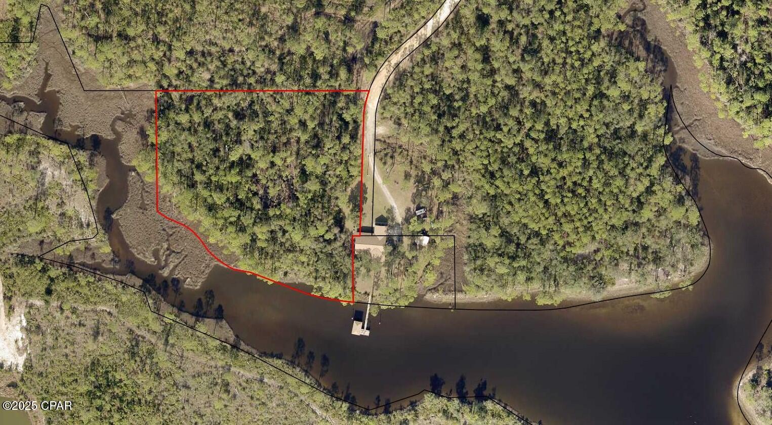 Discover the perfect opportunity to own a stunning piece of waterfront land on Cutchens Road in Southport, Florida. This rare property offers direct frontage on Sheepshead Bayou, which flows into the scenic North Bay. The location provides a unique advantage—your watercraft will be sheltered from storms thanks to the natural protection of the bayou, all while offering quick and easy access to open waters.
With hundreds of feet of waterfrontage, you'll have endless options to enjoy fishing, boating, paddleboarding, or simply relaxing by the water's edge. Launch your boat and take a short ride to the white sands of Panama City Beach, Shell Island and the sparkling waters of the Gulf of America.
Conveniently located, this property is only 20 minutes from Northwest Florida Beaches International Airport and 30 minutes by car to Panama City Beach. Shopping, dining, and entertainment are just a short drive away, ensuring that you have both privacy and accessibility.
Whether you're looking to build your dream home, create a vacation retreat, or hold onto a prime piece of waterfront property, this Southport parcel offers the best of Florida's coastal living. Enjoy breathtaking views, serene surroundings, and the freedom to design a lifestyle centered around the water.
Don't miss this chance to own a slice of paradise in one of the area's most desirable waterfront communities.