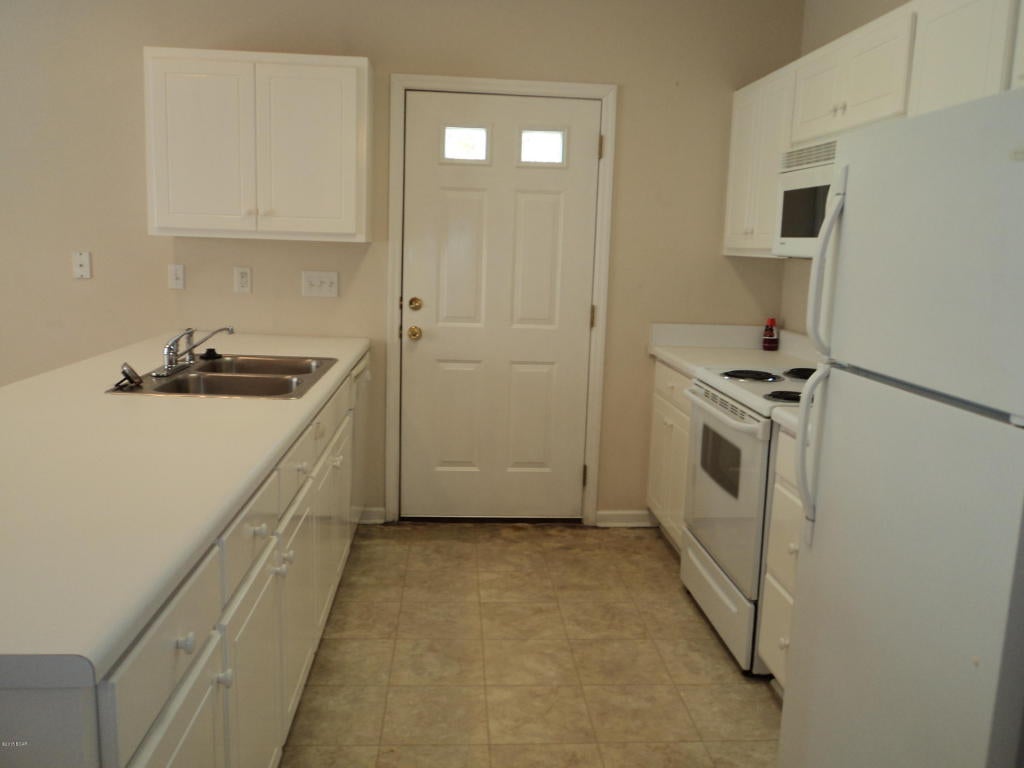 Open floor plan, breakfast bar, washer/dryer connections, ceramic tile and carpet. Efficient drive down to Tyndall AFB, shopping and schools.