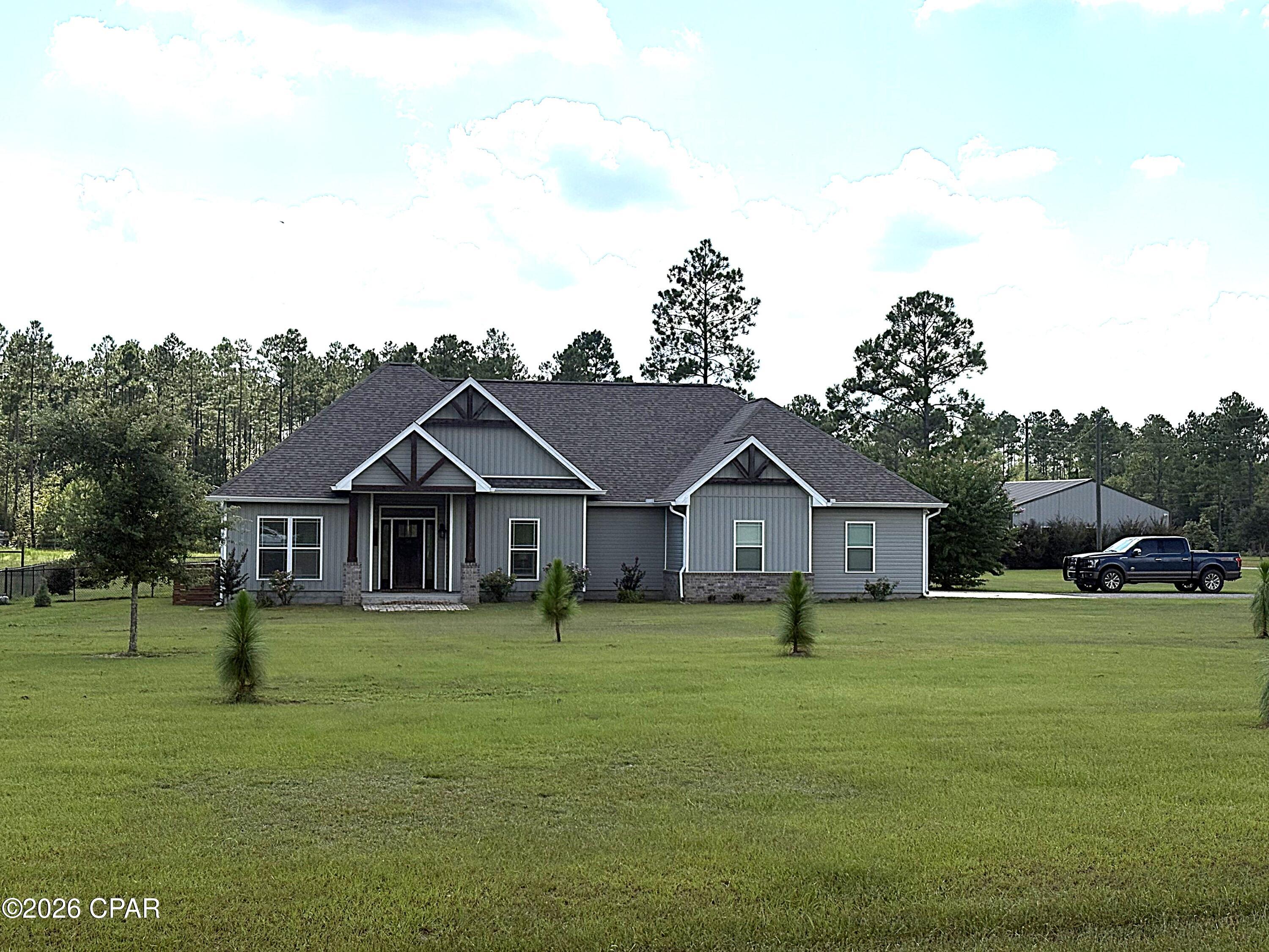 Built in 2020, this immaculate 3BR/2BA home offers 2,231 heated & cooled square feet and is situated on 5.29 acres, providing plenty of room for horses and outdoor enjoyment.
Step through the front door into an inviting foyer that opens to a spacious, open floor plan featuring 9-ft ceilings and beautiful engineered flooring. The living room is centered around a stunning brick gas fireplace, while large windows overlooking the pool fill the space with natural light. The kitchen is designed for both everyday living and entertaining, featuring granite countertops, a breakfast bar, separate breakfast area, and a HUGE pantry. Stainless steel appliances include a gas range and 3-door refrigerator/freezer.
Just off the kitchen is a versatile office that could also be used as a formal dining room or 4th bedroom, although it does not have a closet.
The spacious master suite features 9-ft ceilings, a beautifully appointed bathroom with tile and granite finishes, a step-in shower, and a HUGE walk-in closet. The split-bedroom floor plan provides added privacy, while the additional bedrooms are generously sized and feature walk-in closets.
Step outside to enjoy the beautiful inground pool surrounded by a spacious concrete lounging area, along with a covered back porch and lanai--perfect for relaxing or entertaining. The pool area is enclosed with coated chain-link fencing and is separate from the 5-strand horse-wire fencing surrounding much of the property and pasture.
A 36' x 48' barn provides incredible versatility, featuring a finished 36' x 24' ''man cave'' complete with sheetrock, lighting, spray foam insulation, and a mini-split HVAC unit. The remaining 36' x 24' area offers enclosed storage with a roll-up door and concrete floor.
This move-in-ready property is thoughtfully set up for horses and offers an exceptional combination of comfortable living, outdoor entertaining, and usable acreage. From the immaculate home to the pool, pasture, and impressive barn, this property has so much to offer. Be sure to check out the photos--they tell the story!