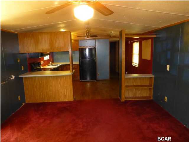 Priced to sell Investors Special! Generate good cash flow! Invest in  painting, cleaning and TLC and you will have a great property to add to your rental portfolio. This 1990 80x14 Fleetwood Mobile Home has 3 bedrooms and 2 baths and appears to be in good overall condition. The master bedroom features a walk-in closet and the master bath is quite spacious. Plush carpet in the living room and master bedroom and attractive wood look vinyl flooring in the kitchen and laundry area. The HVAC system was replaced a few years ago, and all the appliances appear to be newer models as well. Other amenities include a covered front porch and a 12x16 storage building plus a double carport. This mobile home sits on a nicely shaded fenced lot in a quiet area close to Tyndall, shopping & schools.