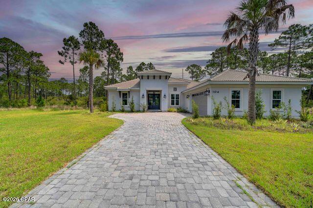 Looking for a luxury home in a gated community?  Look no further than this Aruba floorplan (Signature Level) in Trieste.  All of Trieste is of Mediterranean design, and this home has it all. Here you will find an oversized garage, 9', 10', and 11' ceilings, and a 9' island and wine cooler in the beautiful kitchen. No detail has been overlooked. The master bath has a very large shower with double heads, and the master closet is an amazing 8'x15'. The screened in pool and spa have LOTS of extra area to relax and enjoy the family life. The tranquil living in this community has only luxury homes, low HOA dues, and does not allow short term rentals. Home is basically brand new, as it has never been lived in.  For the right person, seller is also offering an additional 1.7 acre parcel of conservation land behind the home for extra privacy and to enjoy the abundant wildlife. Lots on either side can also be purchased if you need additional space or have always wanted a carriage house.  Call for your private showing today.  All measurements are approx.