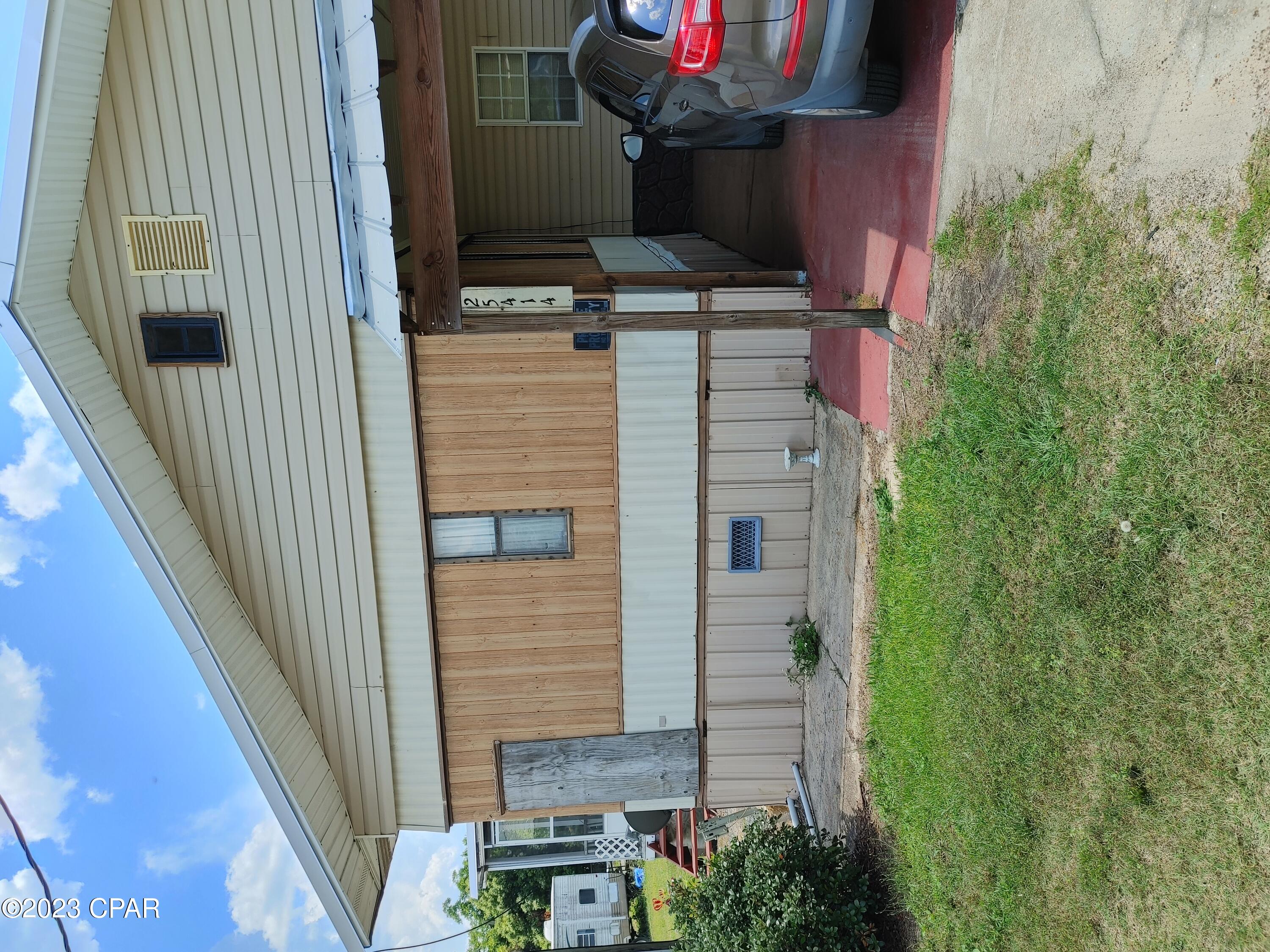 Potential to add 2 more mobile homes or houses to this large property, making it a great investment opportunity (There used to be a home and 2 mobiles on the property). Very spacious custom built mobile home just 4 miles from the Chipola River in this quiet area of Altha. Property is large on a fenced corner lot on city water and a well for irrigation with storage building, workshop, land features 2 new septic tanks, one has never been used, handicap ramps to access the home and covered parking for 2 vehicles as well as the attached carport. Custom cabinets throughout, tons of kitchen storage and plenty of living area for entertaining and the kiddos. New metal roof after Hurricane Michael. Country living at its best.