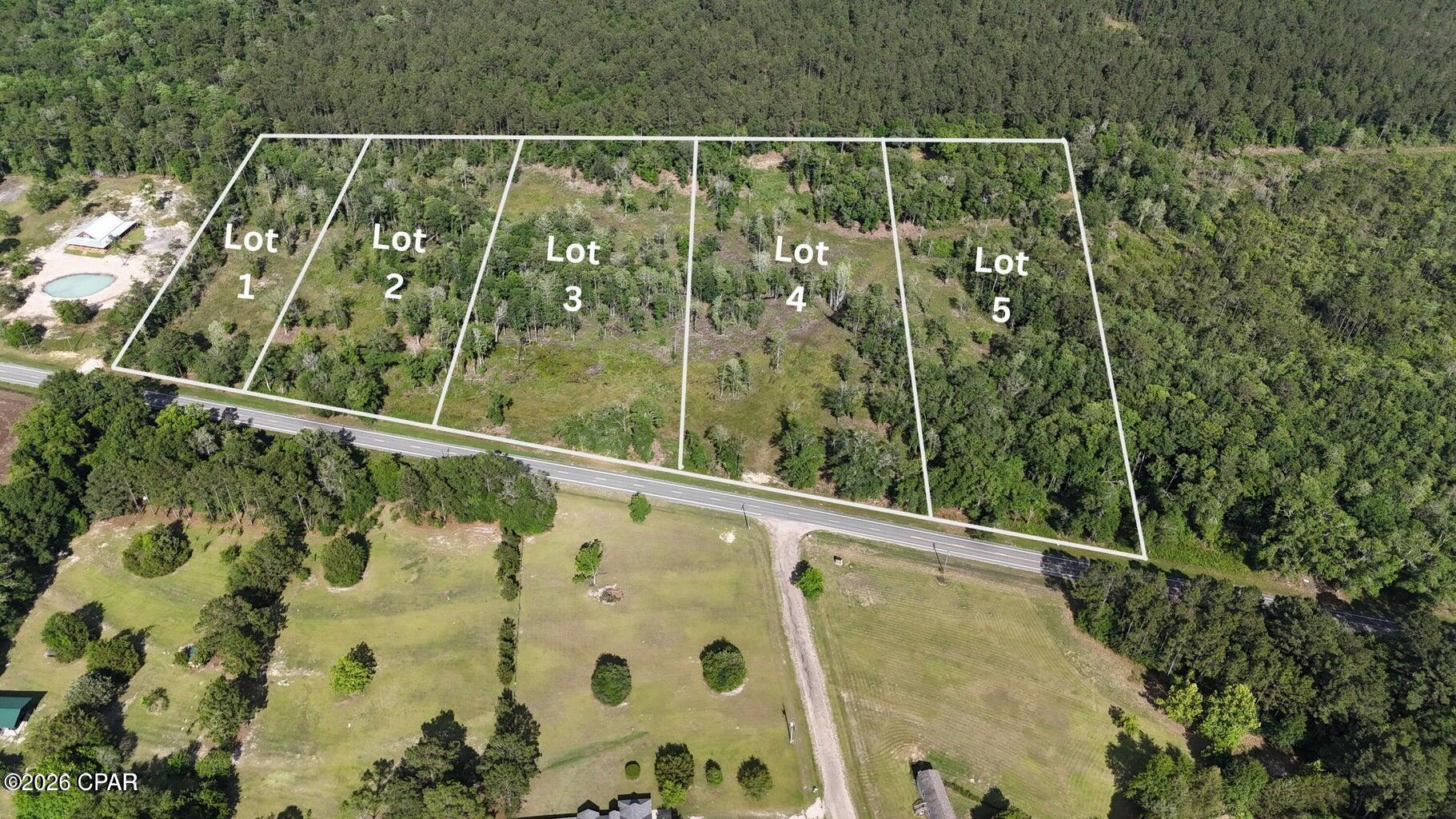 Prime 2.45 acre Lot in Homestead Hollow - Your Gateway to Florida Panhandle Living!  Be the very first to own a piece of this brand-new subdivision in beautiful Holmes County, Florida! This spacious 1-acre corner lot boasts excellent highway frontage, giving you maximum visibility, easy access, and endless potential for your dream build. Whether you're looking to build a custom home, create a family retreat, or invest in the growing Panhandle region, this lot offers the perfect blend of privacy, convenience, and room to roam. Located in a fresh, developing community, you'll enjoy that pioneering spirit of being among the first residents while benefiting from modern subdivision perks. Just over an hour from Panama City and the world-famous sugar-white beaches of the Emerald Coast, you're perfectly positioned for weekend getaways, boating, fishing, or simply soaking up that unbeatable Florida sunshine. Come home to peaceful country living with quick access to coastal vibes - the best of both worlds! Don't miss your chance to claim this corner lot and start building your Florida legacy. Homestead Hollow won't stay empty for long! More lots available.