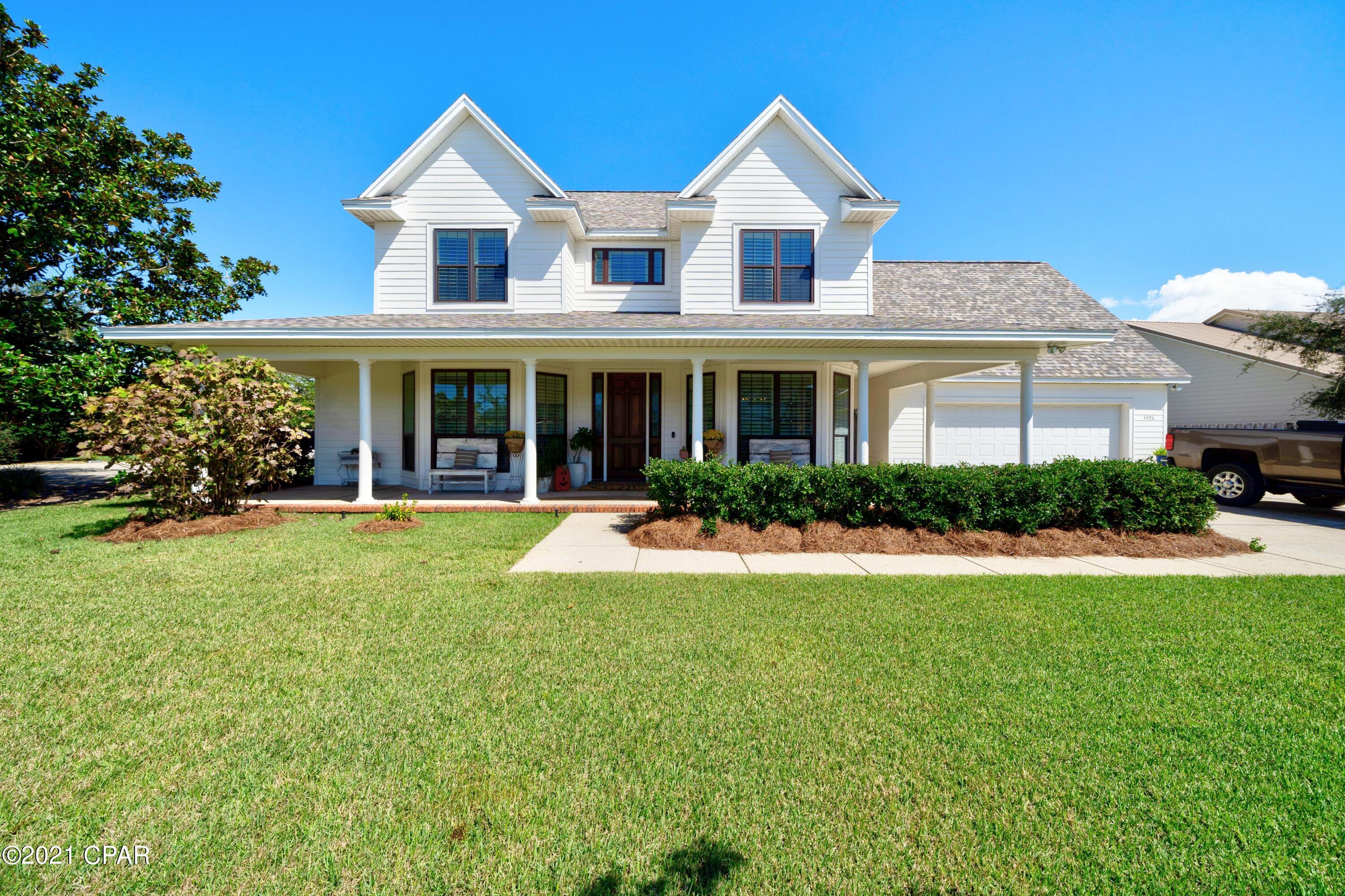 Bay Point Executive Home in Dragon's Ridge. This 3500+ sqft home has a master down, as well as one up, plus an additional full bath on each floor.  The Main level has an open living room with 20' ceiling, dining,  game or exercise room, eat in kitchen, and laundry room.  Upstairs are three bedrooms as well as a den area.  House has a new roof, windows, fresh paint, and LVP floors upstairs.  Large wrap around covered porches provide a country feel, perfect for rocking chairs and porch swings.  The fenced back yard has a private gate to Delwood Beach Rd with public access to St. Andrew's Bay a few houses away.  Yard has plenty of room for outdoor activities and garage is oversized.  This spacious home has been well cared for by the original owner.