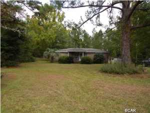 You've been looking for a great home at a great price ? You just found it! This 3/2 sits on 15.5 acres, with a 54X30 barn, drive under storage, and it's nestled in a private setting with paved road access. The home needs a little TLC (trim work, paint, ect...). This listing can be an investment property or your new home. Lots of possibilities. Approx 2 acres are cleared (where the house is) and the other 13.5 are waiting to become whatever you want them to be. Come and take a look and bring your imagination. This home has so much potential for the right owner. If you are looking for a home with no flaws this is not the home for you, however, if you're looking for a home that is priced under value, with good bones, with lots of land, and a barn, that needs some love, This is the