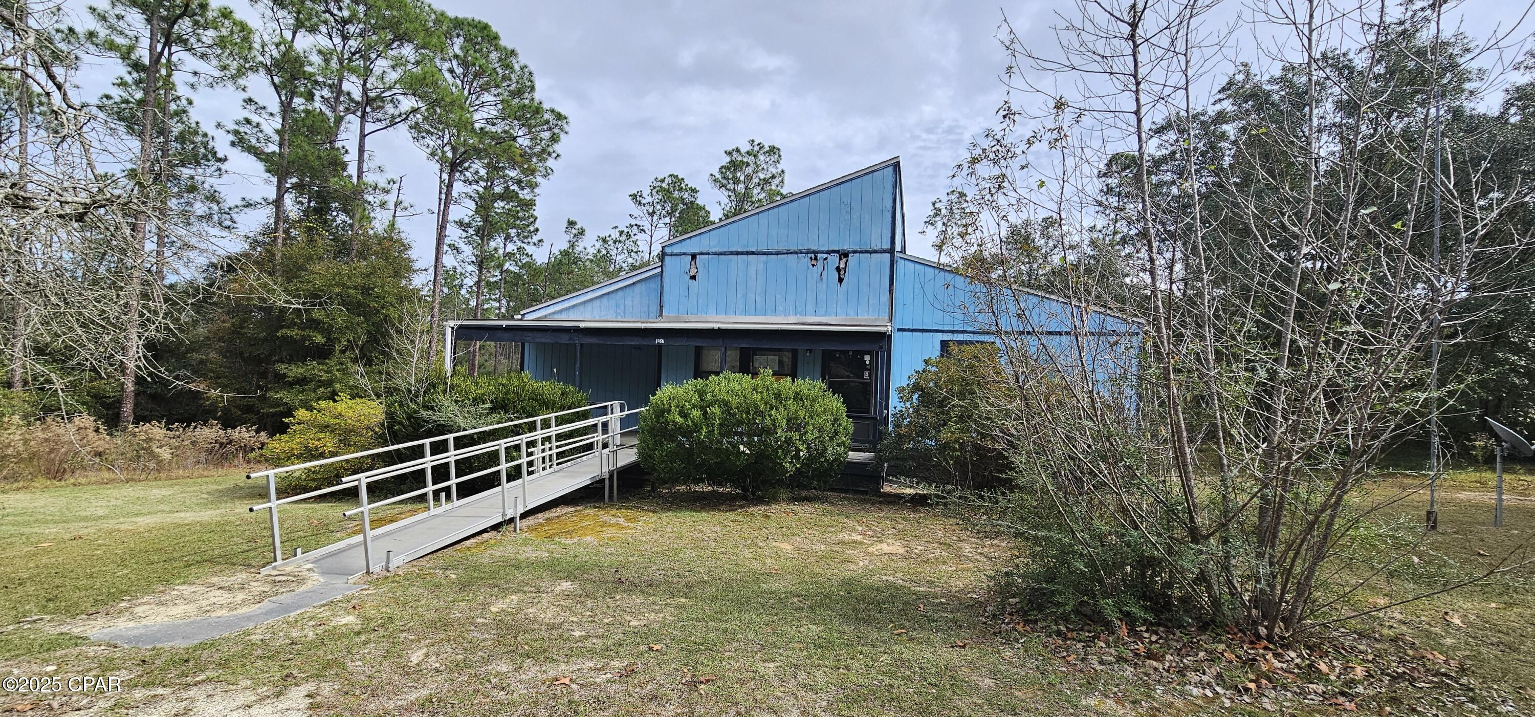 Discover the potential in this charming ''Diamond in the Rough'' located in Alford, Florida, just north of Panama City, Florida. This 3-bedroom, 2-bath home sits on a spacious 1-acre lot, offering plenty of room to create your ideal retreat.

Enjoy peaceful mornings on the covered front porch, surrounded by nature and the sounds of local wildlife. Nestled on a quiet street within Compass Lake in the Hills, this property provides both privacy and convenience.

Located just a short drive from Panama City Beach--home to the ''World's Most Beautiful Beaches''--and with easy access to the Interstate 10 corridor, commuting and travel are a breeze.

Whether you're looking for a full-time residence, a private second home, or an investment opportunity such as a short-term rental, this property offers endless possibilities. Optional HOA membership (approximately $135 annually) provides access to amenities including boating, fishing, and a community pool.

Don't miss your chance to transform this property into something special--schedule your showing today!