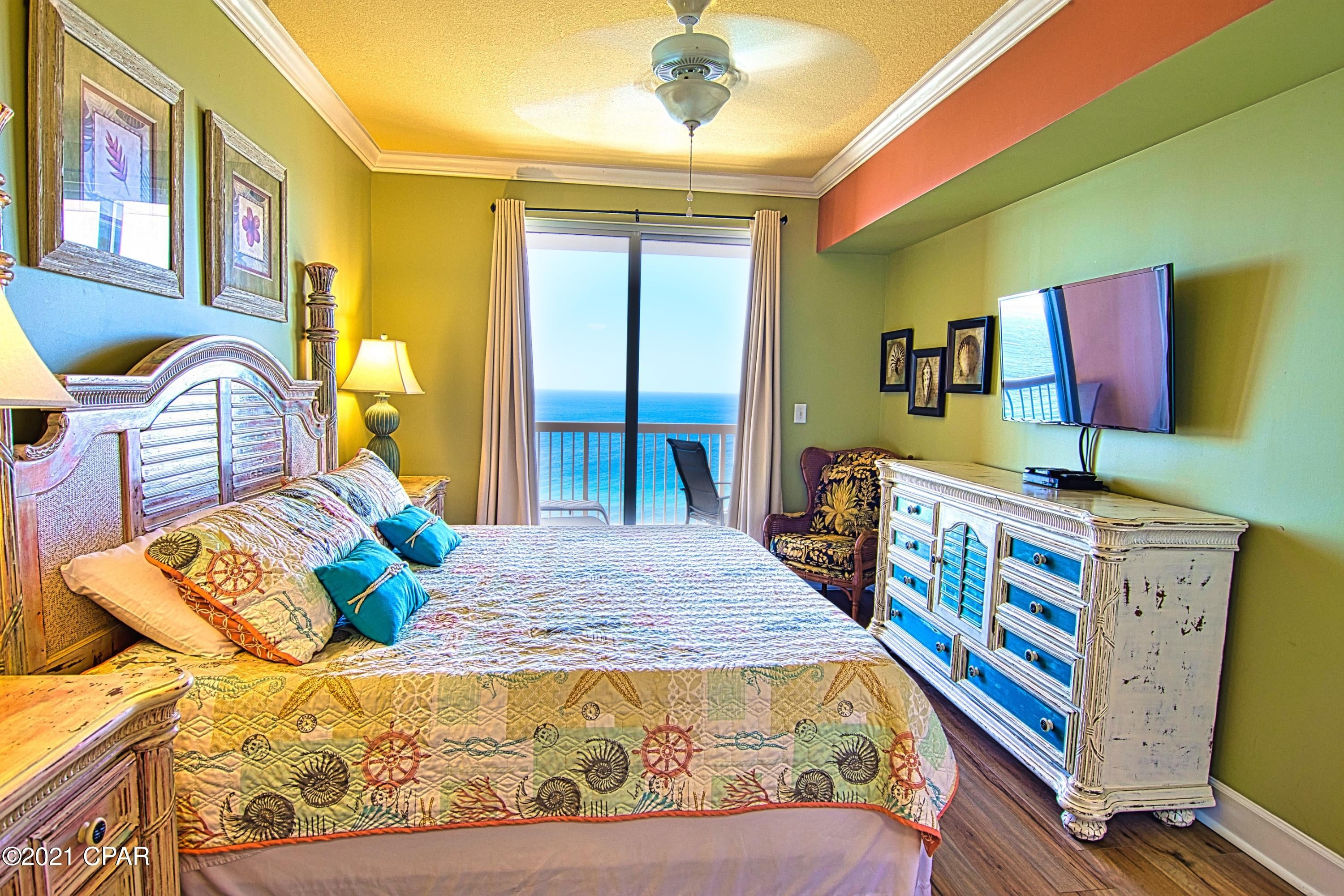 Sunrise 1802 Seller has reduced the price and is now including its own rental website, VisitPCB.com, future bookings, and 2,000+ renter list. This is a luxurious, extra comfortable 2 bedroom condo featuring 2 full bathrooms, master suite directly overlooking the Gulf, plus an oversized bunk room. It is on the 18th floor, directly overlooking the World's Most Beautiful Beach and provides you with a full birds-eye view of the Gulf of Mexico and all its marine life, including schools of rays swimming close to the beach and dolphins playing in the waves.  

This condo has been meticulously maintained and features tile and LVP throughout (no carpet!).  Design features include crown molding throughout, beach decor, quality furnishings and rental ready with everything your guests might expect. Sunrise 1802 has a new water heater, 2-year-old stainless steel kitchen appliances, all solid surfaces and newer AC unit.  

The living room is a perfect gathering place for everyone and features a comfortable sleeper sofa, a love seat and a pair of conversation chairs, as well as a 55" flat screen TV and a Blue Ray player.

The over-sized balcony is accessible through the floor to ceiling sliding glass doors from both the living room and master bedroom.  Walk out onto the spacious balcony and enjoy a spectacular view of the beach.  

The dining area can seat 6 at the table plus the breakfast bar accommodates 3 more, so the family can share meals and trade their favorite part of the day at the beach. 

The open gourmet kitchen area looks out over the water and features beautiful granite counter tops, attractive wood cabinets, generous sized pantry and stainless steel appliances. 

The master bedroom has a king bed and enjoys amazing views of the Gulf and access to the balcony through a large sliding glass door.  The master area has generous-sized his and hers closets and the master bathroom features double vanities, large garden tub and separate shower.  

The second bedroom is equally well appointed with a comfortable queen sized bed and plenty of space for everything you've brought to the beach and features a large flat screen TV.  
The bunk room contains large over-sized beds which are perfect for children, or small adults and has a flat screen TV as well.    
This condo also features a large laundry room with 3 year-old washer and dryer and inside lockable owner's  storage closet.  

Sunrise Beach is located close to Pier Park and an easy walk to numerous restaurants.  Owners and guests especially love the parking which is located under the building (no long walk across Front Beach Road).  The amenities include two large beach side pools, a mushroom fountain for the kids to enjoy, a large fitness center and beachside grills.  

This condo is a great rental unit and owner will work with buyer to transfer over any rentals currently on the books if they desire.  
Call today to schedule your showing of this beautiful condo.  

*All information and measurements are deemed reliable but not guaranteed. If important, please verify.