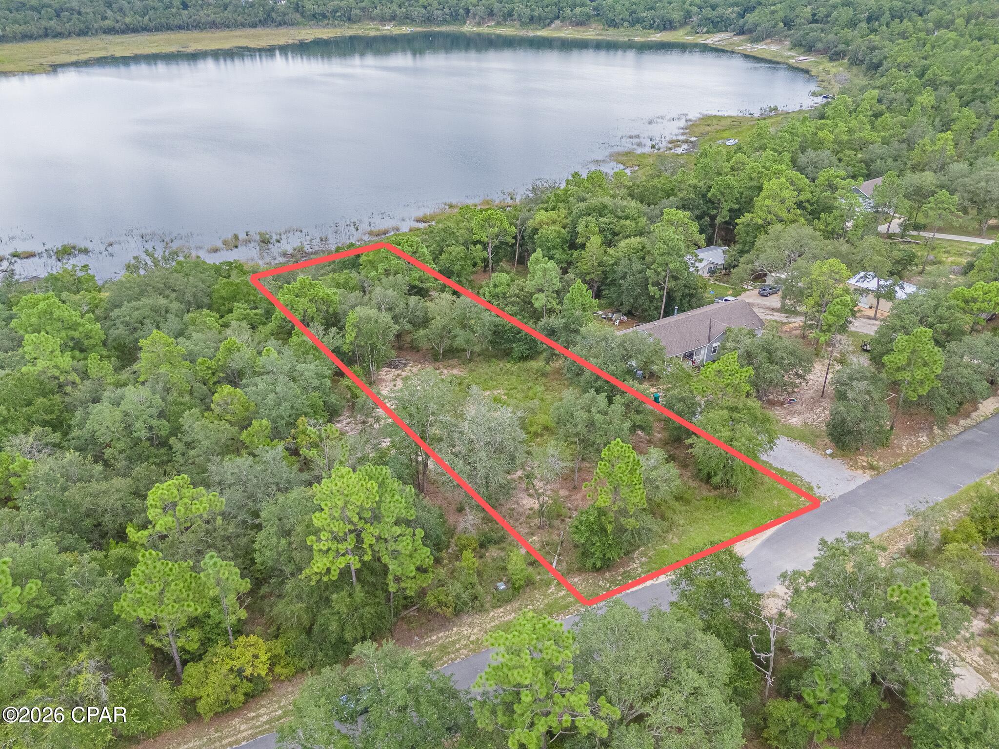 Come enjoy lake life in Washington County with your own 1+ acre of lakefront land. Build your dream home with a view in this gated equestrian community (manufactured homes are allowed, too). Community property owners enjoy a pool, tennis court, basketball court, playground, pavilion, equestrian trails and two lakes for recreational fishing, boating and swimming. Residents of Leisure Lakes gather for holidays and special events as neighbors and family. Community information available at https://www.leisurelakescommunity.com/