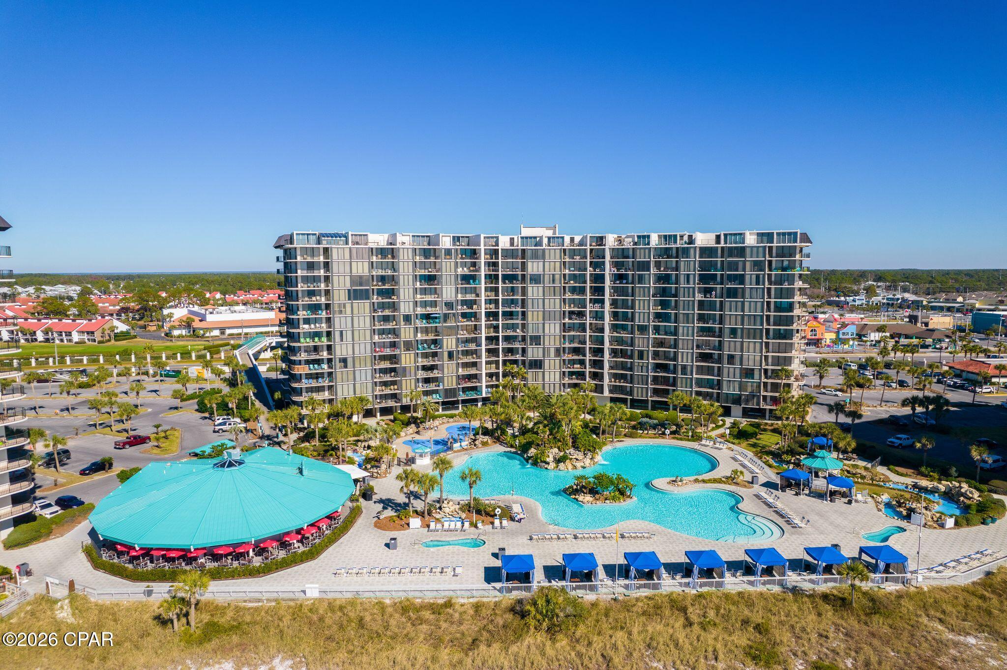 Welcome to Edgewater Beach Towers, one of Panama City Beach's most iconic Gulf-front resort communities! Ideally located on the first floor of desirable Tower I, Unit 103 offers the convenience of easy access to the beach, 11,500 sq. ft. lagoon-style resort pool and resort amenities--making it an excellent choice for a vacation home, second home or short-term rental investment. This spacious 3BR/3BA unit offers an updated kitchen with granite countertops & stainless steel appliances, oversized bedrooms, and a balcony overlooking the resort pool and beautiful gulf. Edgewater is known for its impressive resort-style amenities and prime location in the heart of PCB. Spend your days along the resort's private white-sand & turquoise waters beach. The resort also offers an executive Par-3 golf course, tennis and pickleball courts, spa, fitness center, basketball, shuffleboard and more. On-site dining and conveniences, including Ocean's Bar & Grill, make it easy to enjoy your stay without ever leaving the resort. Beyond the gates, you'll be just minutes from some of Panama City Beach's most popular dining, shopping and attractions, including Shipwreck Island Waterpark, Pier Park and the area's many entertainment and water activities. Whether you're looking for your own beach getaway or an investment property in an established vacation rental destination, Unit 103 offers an opportunity to own in one of PCB's most amenity-rich Gulf-front resorts.