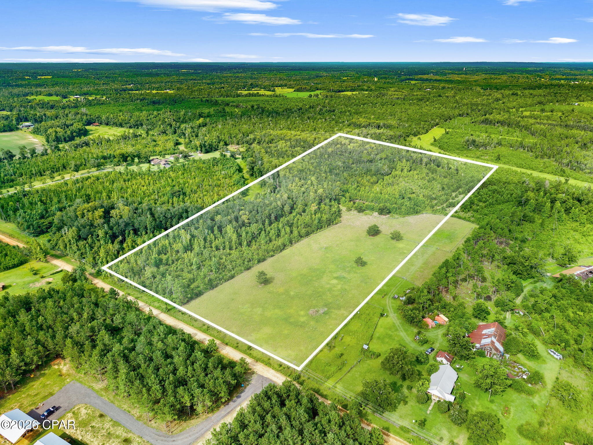 Escape to the peace and privacy of country living with this approximately 18-acre tract in rural Jackson County. Being subdivided from a larger parcel, this property offers a sizable cleared area ready for your dream home, mini-farm, or agricultural venture, along with wooded acreage for privacy and recreation. A small pond adds to the property's charm, while power is available nearby for added convenience. Zoned Agriculture, the property offers a variety of potential uses, subject to applicable regulations. Conveniently located just minutes from Cottondale and U.S. Highway 231, this is an excellent opportunity to enjoy the quiet of the countryside with easy access to nearby communities. Property is subject to survey and approval of the subdivision by the appropriate governmental authorities. Approximate boundaries shown are for illustration purposes only.