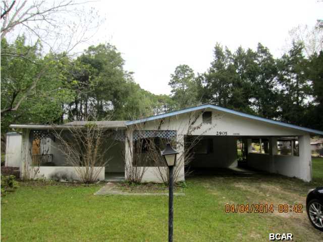 GREAT OPPORTUNITY TO OWN A SPACIOUS HOME ON A LARGE CORNER LOT! This home will need a new roof with some ceiling repairs, but it has had many updates. The home features ceramic tile flooring throughout the house, an eat-in kitchen with all appliances, and a family room with a fireplace. The laundry room is large enough to use as a small office or craft room. The home is on a corner lot with a covered porch and a carport. Home being sold in its AS IS condition.