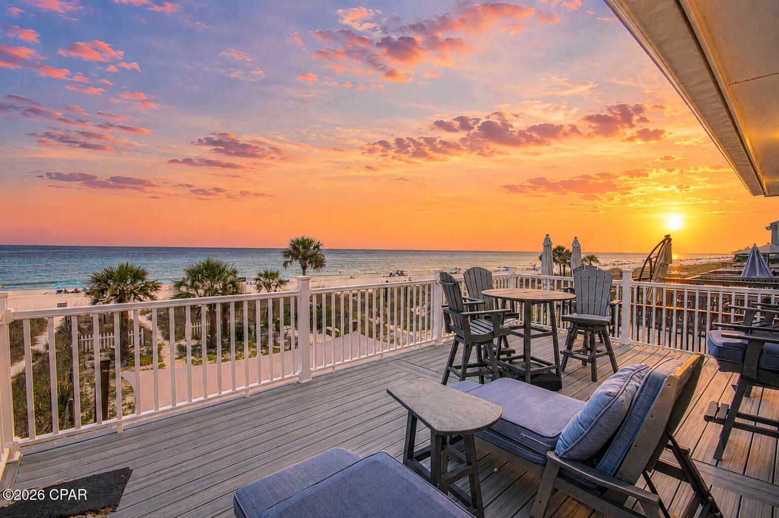 ***CURRENTLY UNDER CONTRACT, SELLER WILL CONSIDER BACKUP OFFERS***3BR/2.5BA Gulf-front townhome in Laguna Beach, Panama City Beach. No HOA. 25' of beachfront, 2,128 SF, fully furnished and truly turnkey. Perfectly positioned along the sugar-white sands of Laguna Beach, this beautifully renovated Gulf-front townhome offers a rare opportunity to own 25 feet of direct Gulf frontage with no HOA fees. Offering approximately 2,128 square feet, this fully furnished three-bedroom, two-and-a-half-bath residence has been thoughtfully updated throughout, creating a move-in-ready and rental-ready property where every major improvement has already been completed. The moment you step inside, the Gulf becomes the centerpiece of the home. The expansive open-concept living, dining, and kitchen area was designed to maximize both space and the spectacular waterfront setting. A wide wall of windows and glass sliding doors stretches across the rear of the home, filling the interior with natural light while framing breathtaking Gulf views. The beautifully renovated kitchen features quartz countertops, a large island with breakfast bar seating, stainless steel appliances, a gas range, wine refrigerator, generous cabinetry, and abundant workspace, making it equally suited for everyday living and entertaining. All three bedrooms are located upstairs for added privacy. The Gulf-front primary suite opens directly onto the expansive 22.5' x 13.5' beachfront deck through glass sliding doors, while an adjoining wall of windows showcases panoramic Gulf views. The second bedroom also enjoys direct access to the same oversized deck and features expansive Gulf-facing windows. The third bedroom is furnished with bunk beds for additional guest accommodations. All bathrooms have been beautifully renovated. The primary bath features a spacious walk-in double shower, while the second full bath offers a tub/shower combination with convenient access from both the hallway and second bedroom. The spacious main living area offers additional flexibility with a sleeper sofa and generous open space for hosting overnight guests. Outside, the covered lower deck includes durable outdoor furnishings and an outdoor shower. Beyond the deck, approximately 48 feet of additional Gulf-front outdoor space extends to the property line, providing room for outdoor entertaining, a fire pit, games, landscaping, or simply enjoying the open beachfront setting. Upstairs, the oversized deck provides another incredible place to enjoy morning coffee, coastal breezes, and unforgettable sunsets. Recent improvements include a dimensional shingle roof installed in 2023, Hardie Board exterior siding completed in 2021, tile flooring throughout, and beautifully renovated bathrooms. High-end furnishings, appliances, décor, kitchenware, and outdoor furnishings all convey with the sale, allowing the next owner to simply arrive and begin enjoying the property immediately. A one-car garage and an interior storage room with a full-size washer and dryer provide valuable storage for beach equipment and everyday convenience. Located on the quiet west end of Panama City Beach, Laguna Beach offers a relaxed coastal setting while remaining close to shopping, dining, and entertainment. Thomas Donut & Snack Shop and Carousel Supermarket are just a short distance away. Beachfront properties offering direct Gulf frontage, generous living space, quality renovations, furnishings that convey, short-term rental eligibility, and the added financial advantage of no HOA fees are increasingly difficult to find. This is a rare opportunity to own a beautifully updated beachfront home where every detail has already been thoughtfully completed. Simply arrive, unpack, and let the Gulf become part of your everyday life.