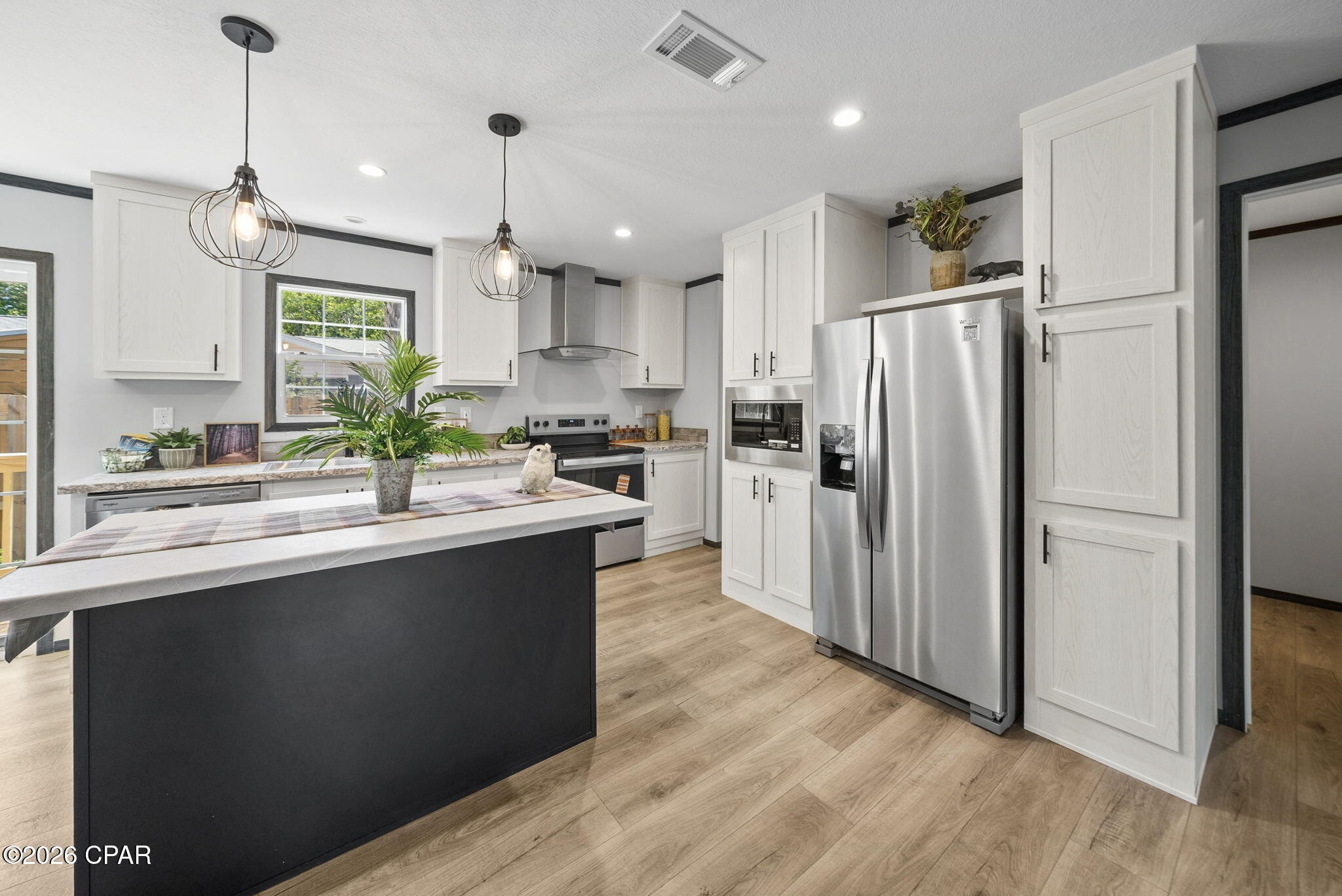 Welcome to your slice of the Emerald Coast! This brand-new 2026 Champion Home at 115 N. San Souci Street is currently under construction and expected to be move-in ready by September 14th, 2026. Featuring full drywall interior throughout, a premium upgrade that gives this manufactured home the look, feel, and quality of traditional stick-built construction -- plus brand-new stainless appliances and fresh finishes, this home offers modern comfort in the sought-after Miramar Heights neighborhood. No HOA rules or fees to worry about. Backed by a 1-year manufacturer's warranty for complete peace of mind. Just minutes from the World's Most Beautiful Beaches, Pier Park, Northwest Florida Beaches International Airport (ECP), and scenic 30A. Investors and vacation rental buyers, take note. Don't miss your chance to own brand-new construction in one of PCB's most desirable pockets!
Photos shown are of the exact model of mobile home located on Vestavia St.  Contact agent for details
